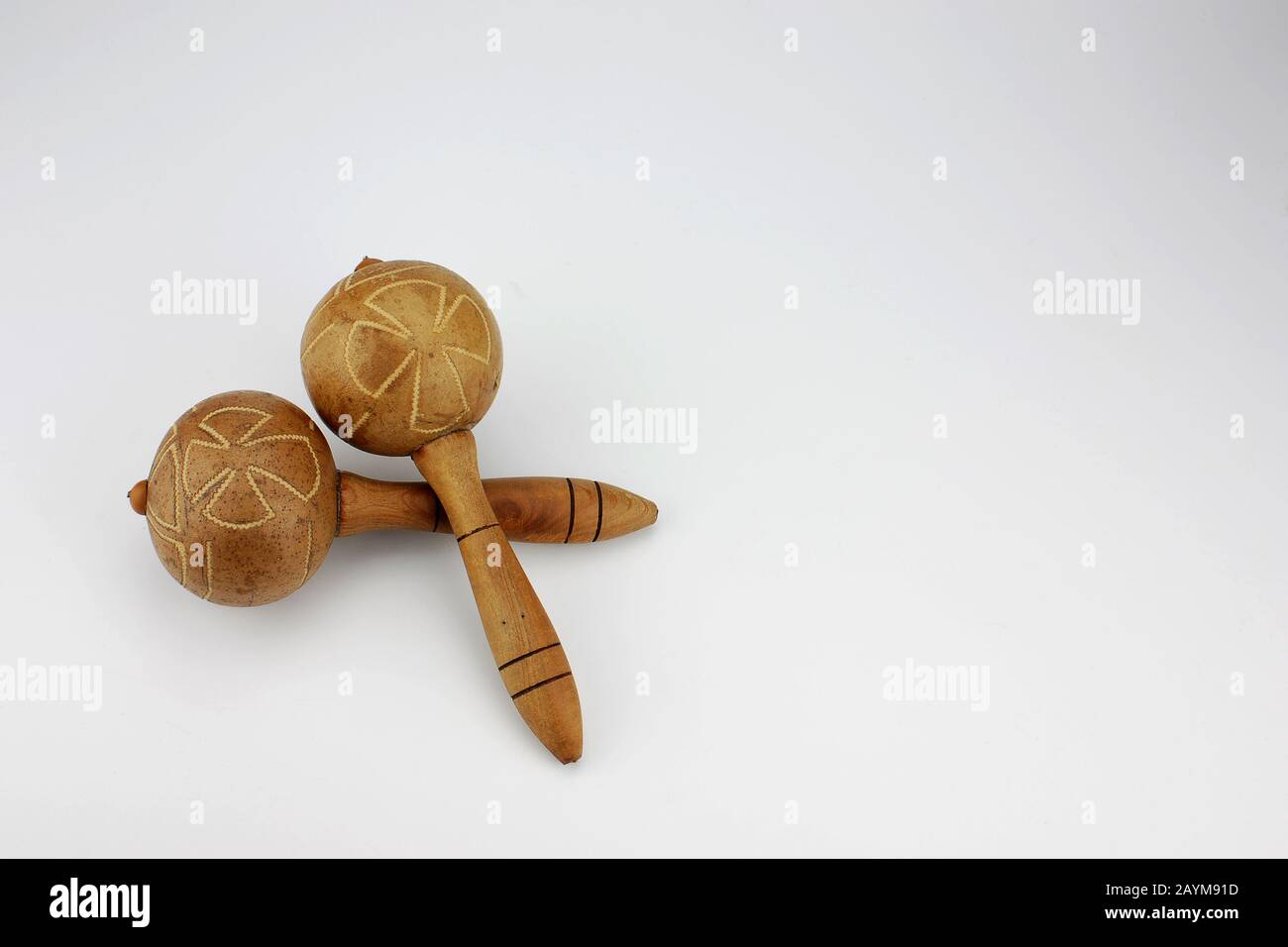 Two maracas isolated on white background. Widely used in Latin dance folk music of Cuban influence and in Venezuelan-Colombian llanero folklore. Stock Photo