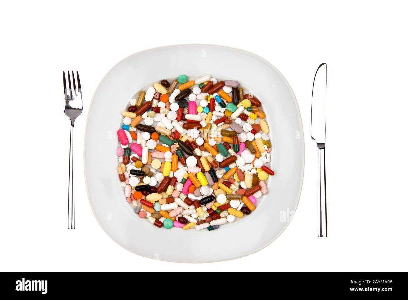 many colorful pills on a plate Stock Photo
