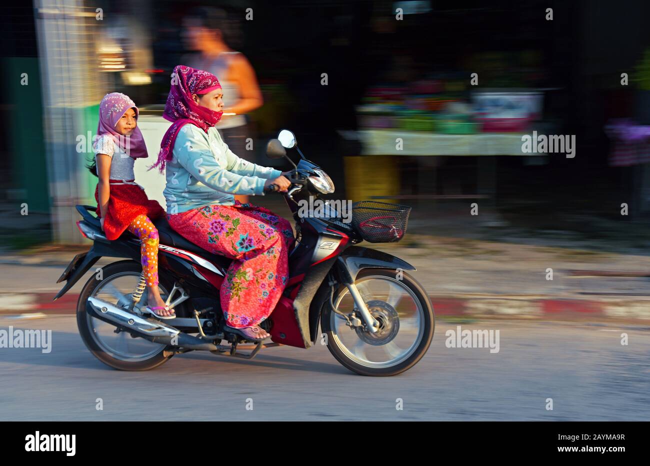 mother riding motorbike with her daughter, Thailand, Kho Yoa Noi Stock Photo