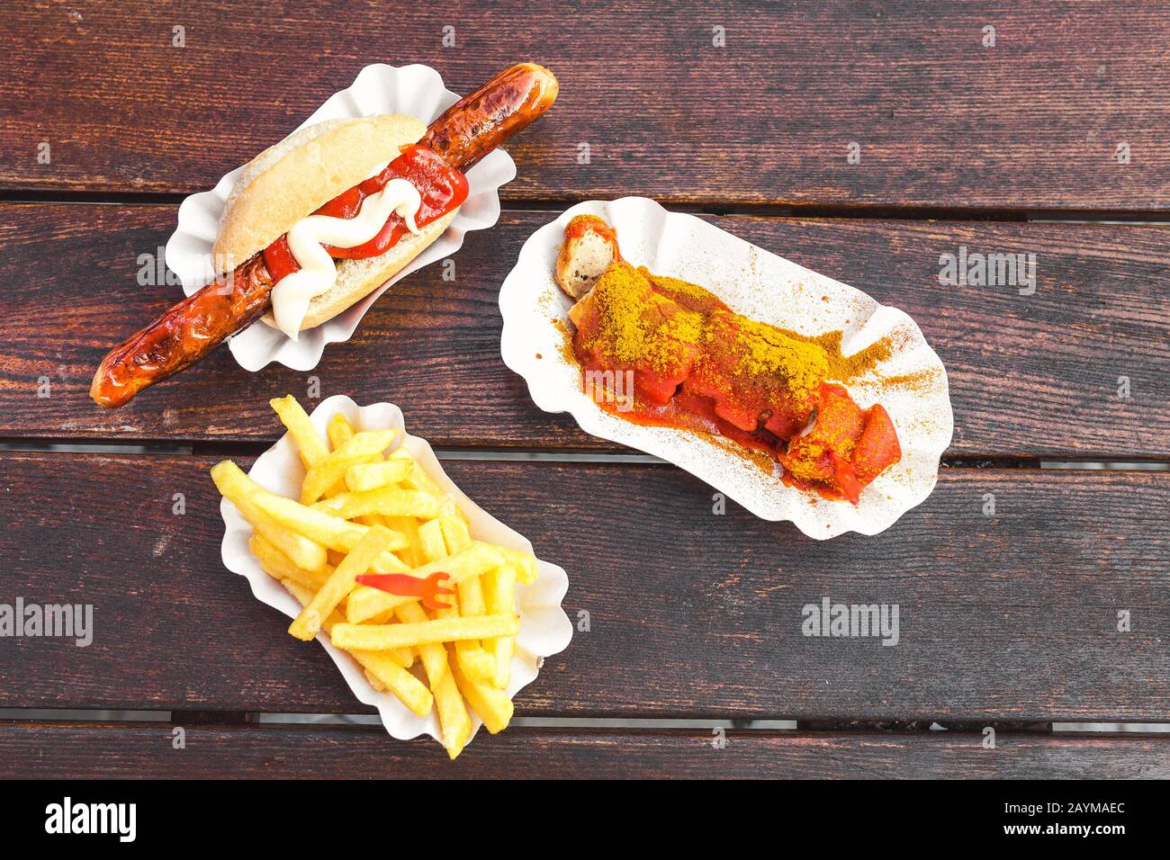 German curry wurst sausage with french fries, street food concept Stock