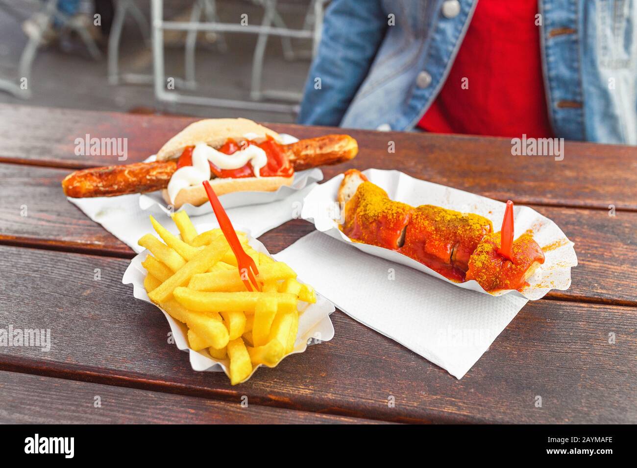German curry wurst sausage with french fries, street food concept Stock