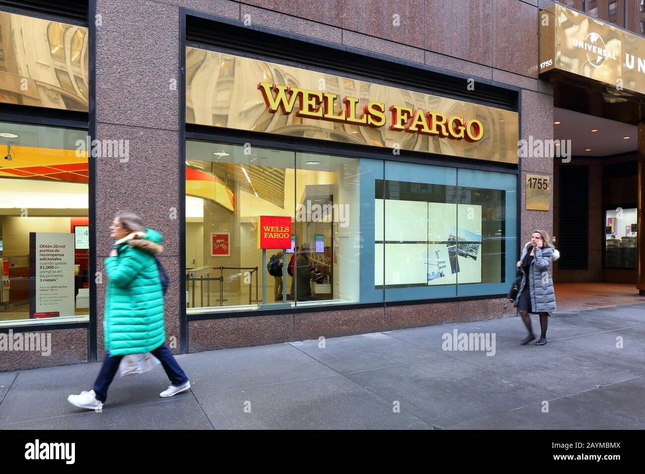 People walk past a Wells Fargo bank on Broadway in Manhattan, New York, NY. Stock Photo