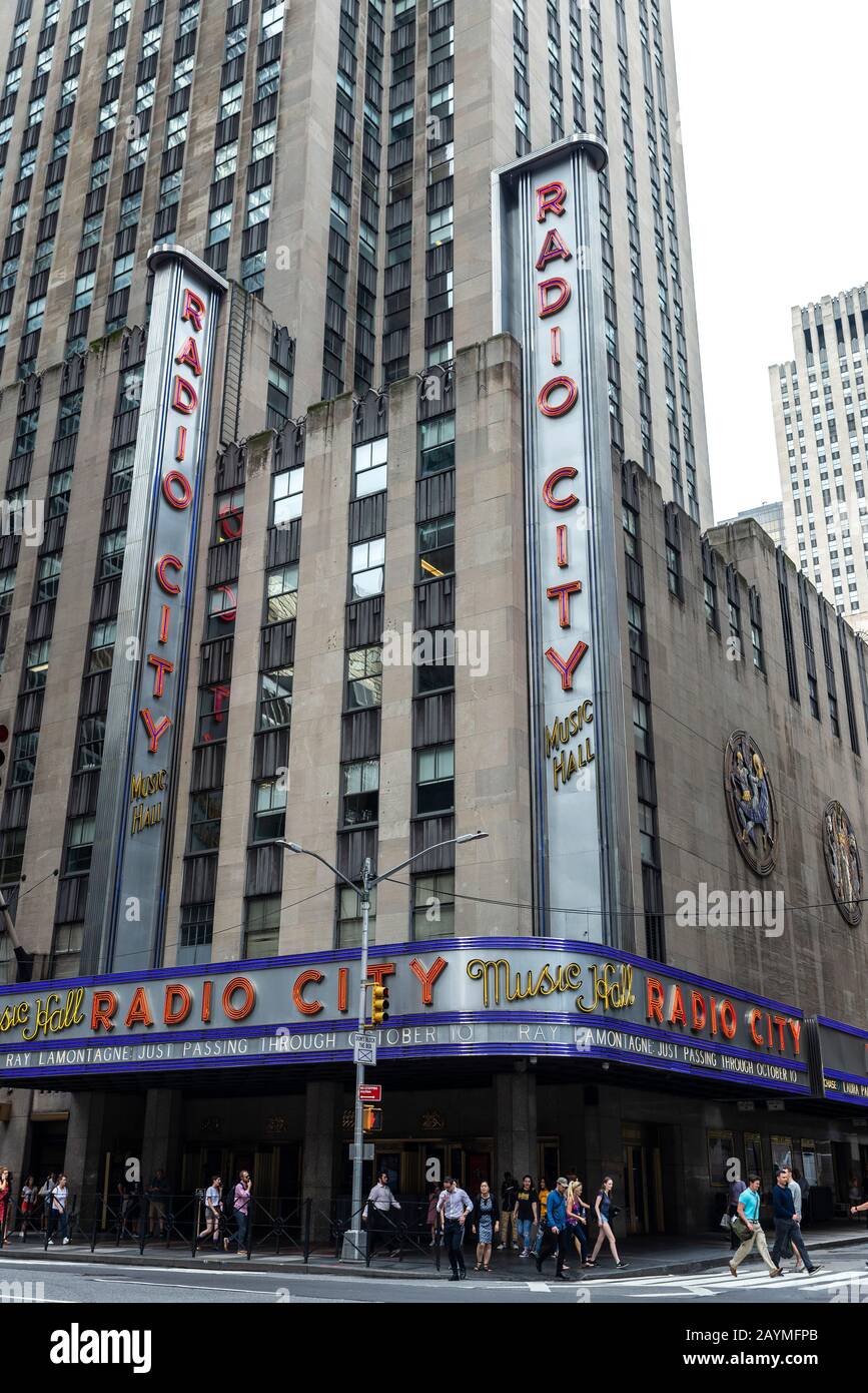 New York City, USA - August 3, 2018: Sign of the Radio city hall at NBC Studios headquarters in the 30 Rockefeller Plaza with people around in Manhatt Stock Photo