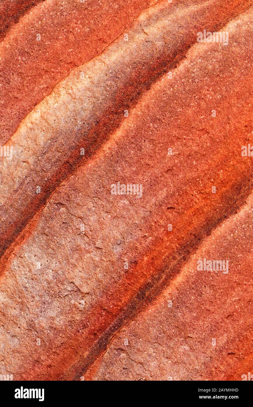 The multi-colored exposed sandstone rock and mineral layers inside the ancient tombs of Petra, Jordan. Sandstone pattern, geological texture in Petra, Stock Photo