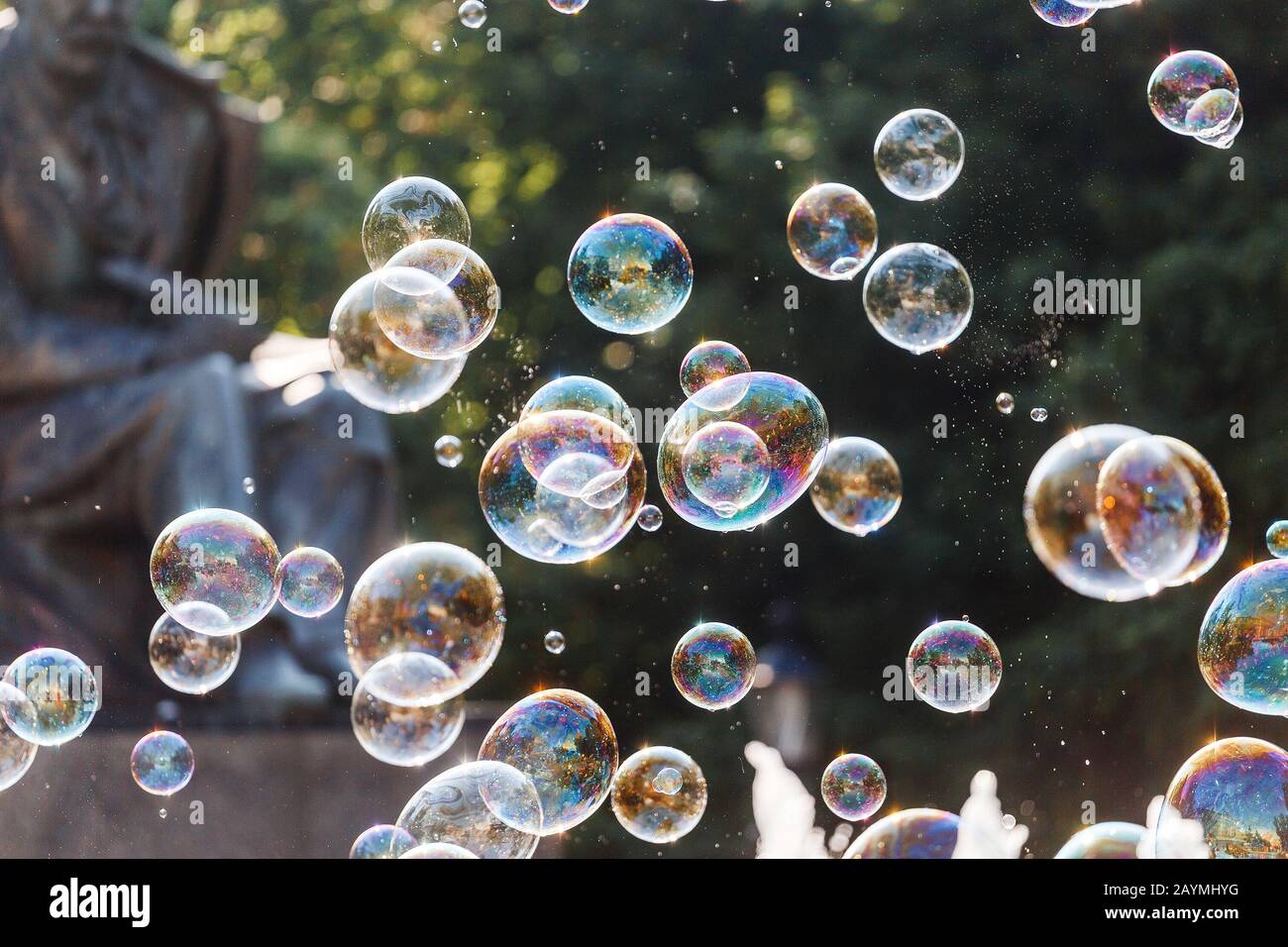 Many soap bubbles close-up in summer park Stock Photo