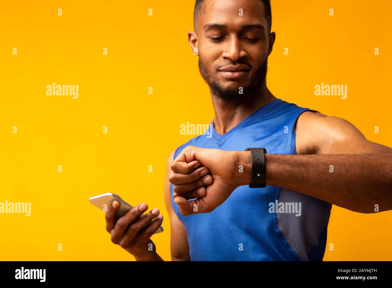 Headshot of afro guy looking at his wrist watch Stock Photo Alamy