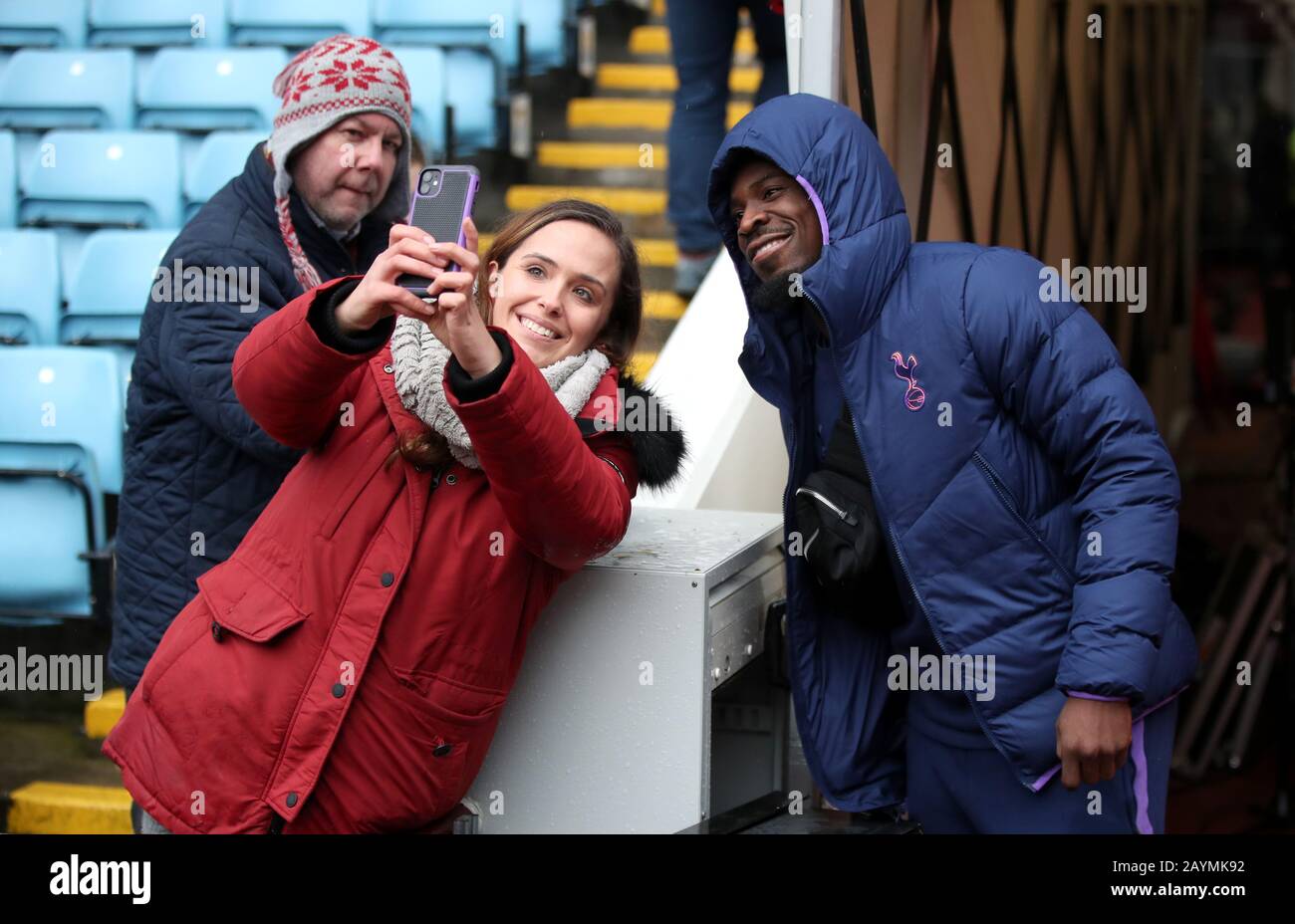 Tottenham Hotspur's Serge Aurier poses for a photo with a fan prior to the Premier League match at Villa Park, Birmingham. Stock Photo