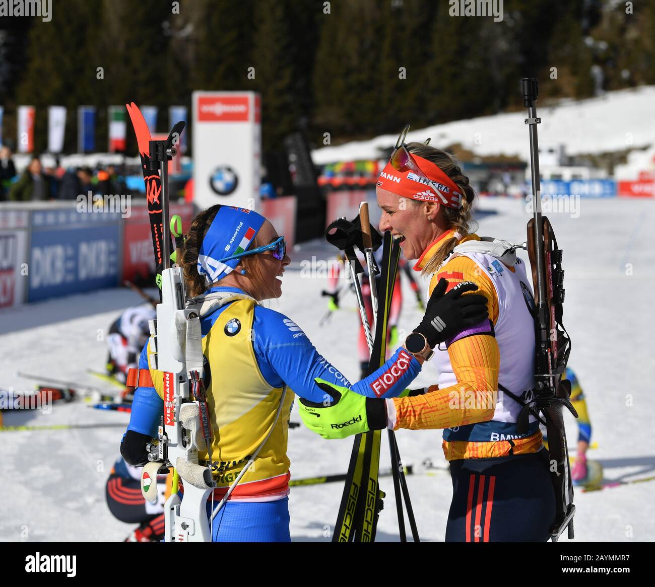 Antholz, Italy. 16th Feb, 2020. Biathlon: World Championship, pursuit 10 km,  women. The winner Dorothea Wierer (l) from Italy and the runner-up, Denise  Herrmann from Germany, congratulate each other at the finish.
