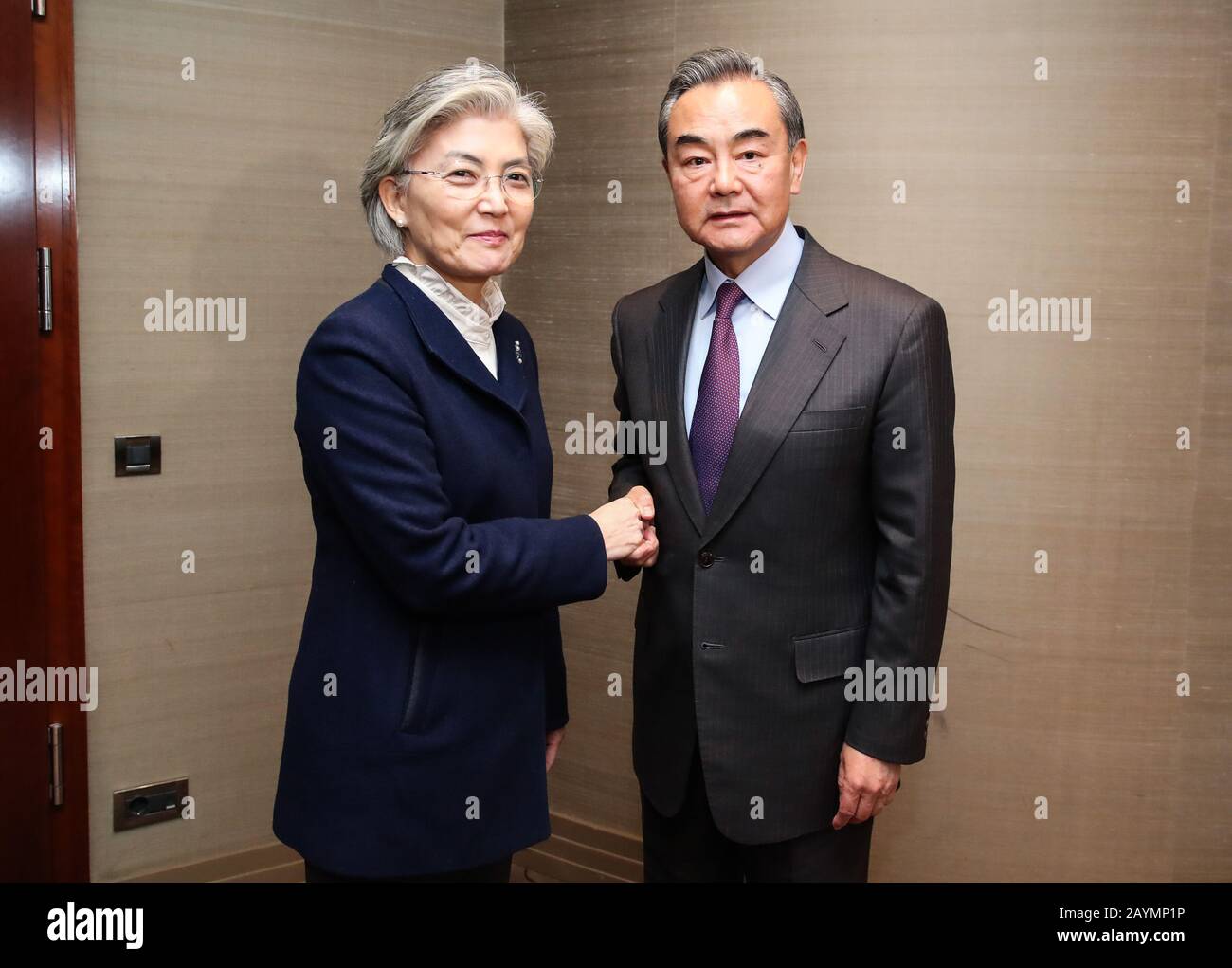 Munich, Germany. 15th Feb, 2020. Chinese State Councilor and Foreign Minister Wang Yi (R) meets with South Korean Foreign Minister Kang Kyung-wha on the sidelines of the 56th Munich Security Conference in Munich, Germany, Feb. 15, 2020. Credit: Shan Yuqi/Xinhua/Alamy Live News Stock Photo