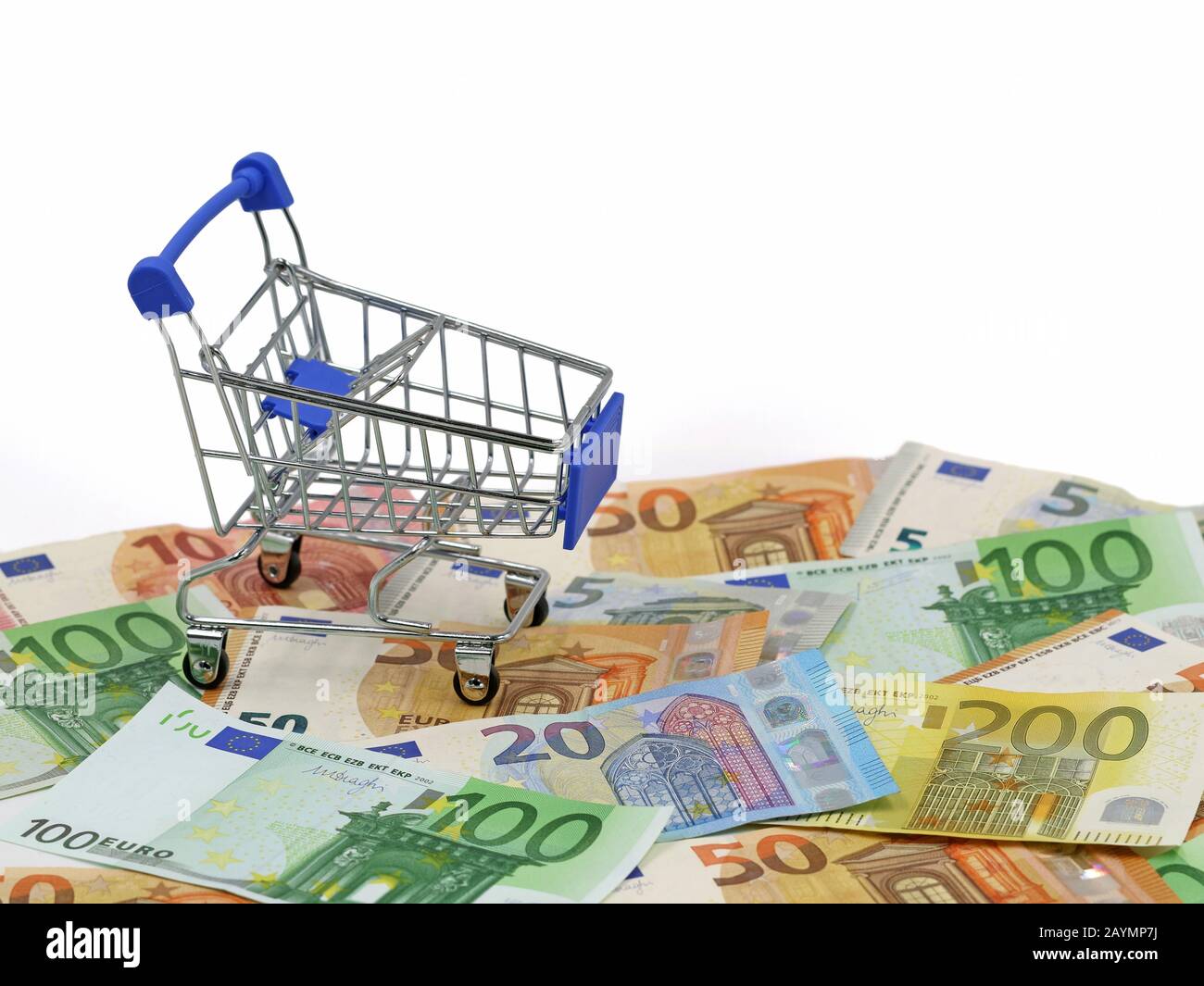 shopping cart on euro banknotes, european currency with white background and copy space Stock Photo