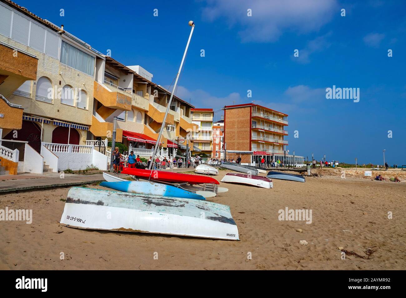 Small boats, dingies, on the beach-front at La Mata, Torrevieja, Costa Blanca, Spain Stock Photo