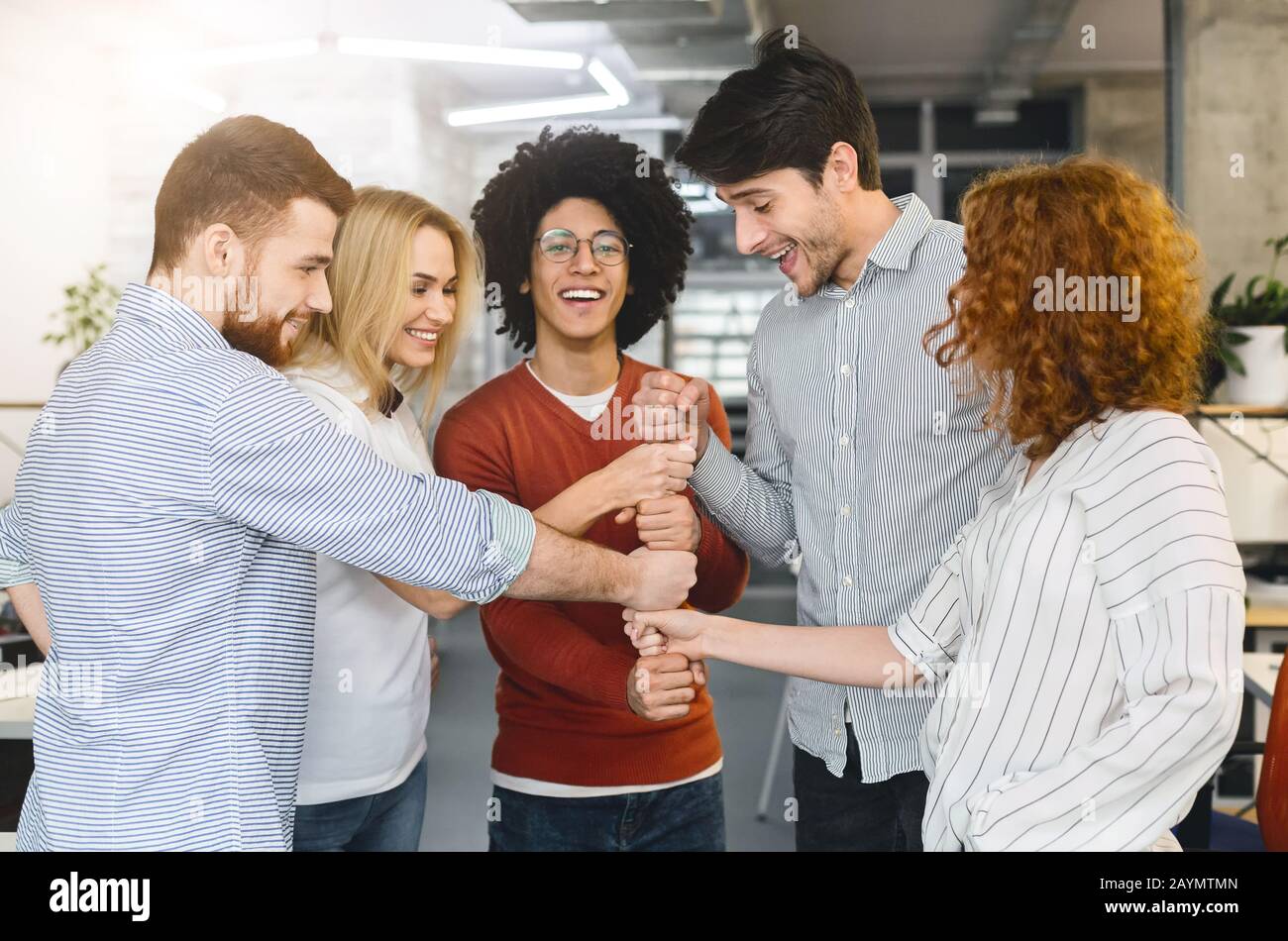 Creative business team putting hands hi-res stock photography and ...