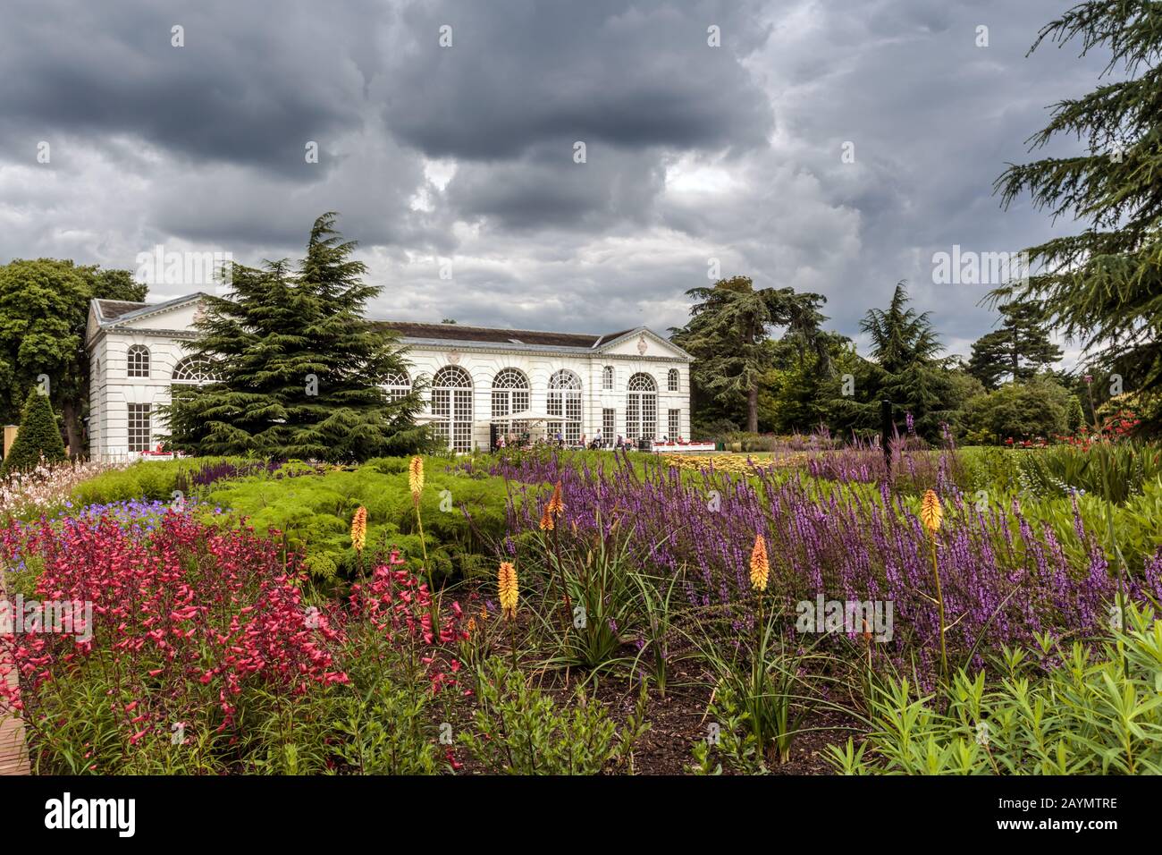Flower beds in front of the Orangery, designed by Sir William Chambers, and completed in 1761. The Royal Botanic Gardens, Kew, Surrey, England. Stock Photo