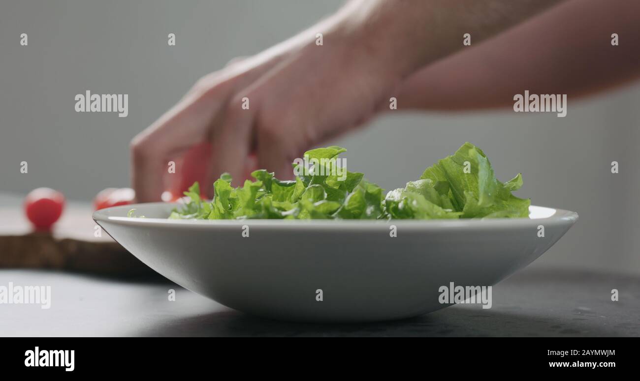 Man Add Frisee Salad Leaves Into White Bowl Wide Photo Stock Photo Alamy