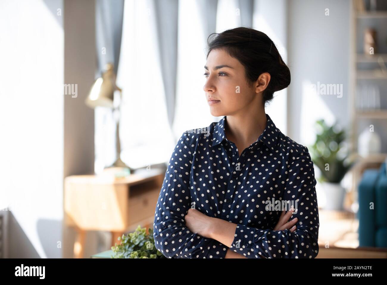 Pensive indian girl lost in thoughts thinking Stock Photo - Alamy