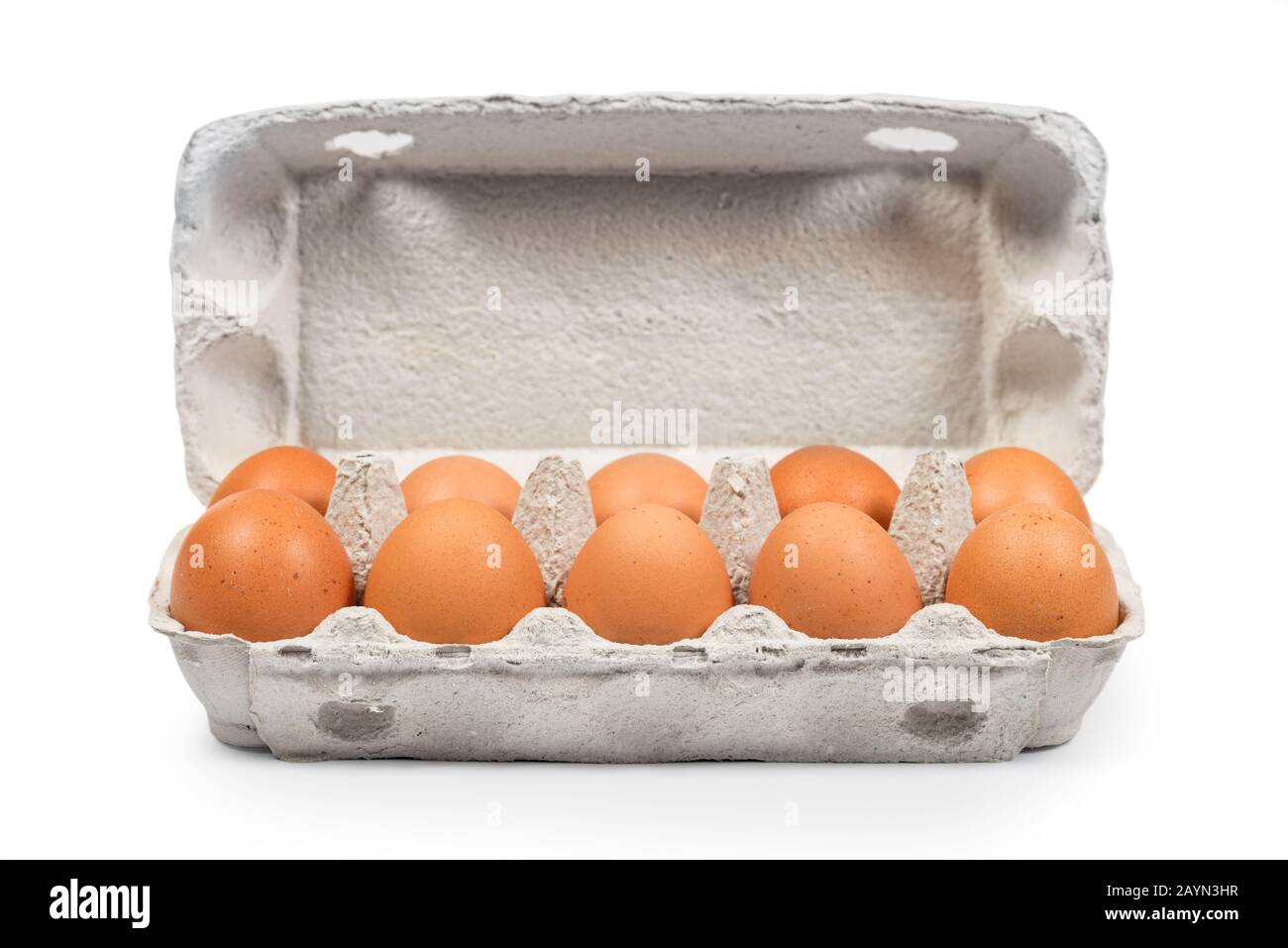 Brown eggs in the cardboard package box front view. Clipping path for easy cut out Stock Photo