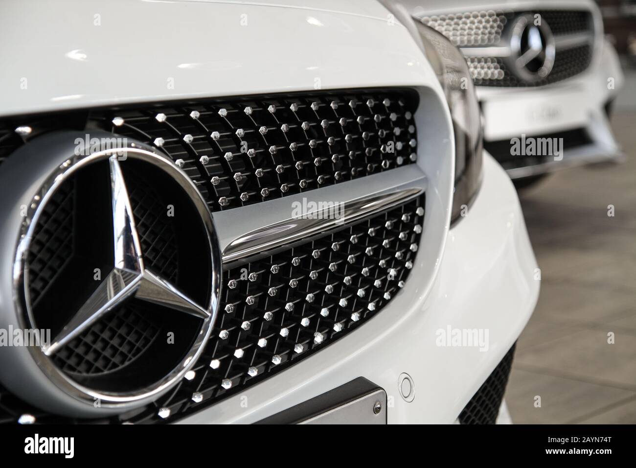 Brand New Mercedes.  White Mercedes-Benz car in showroom Stock Photo