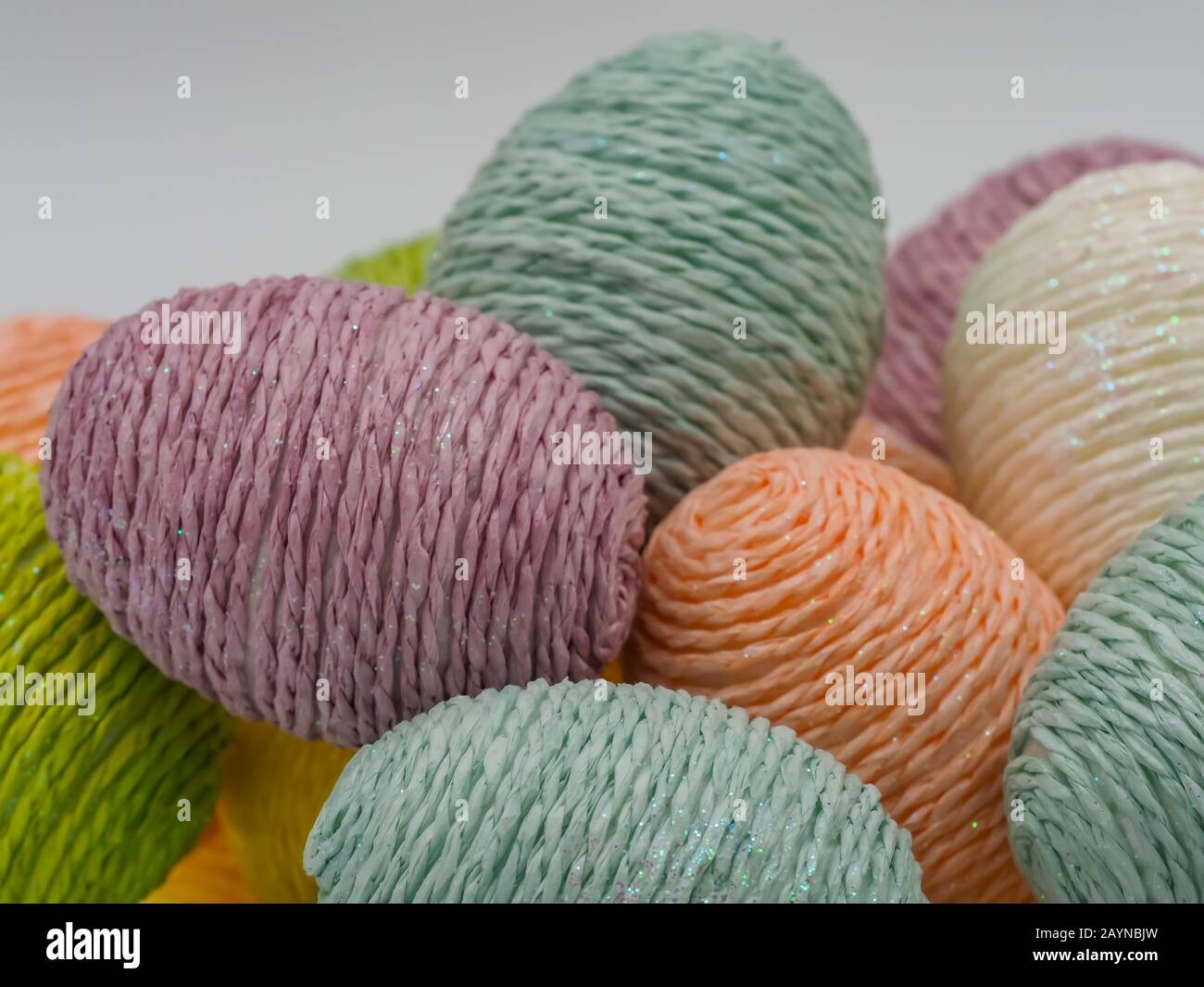 String wrapped Easter eggs in purple, blue, white, green, yellow and