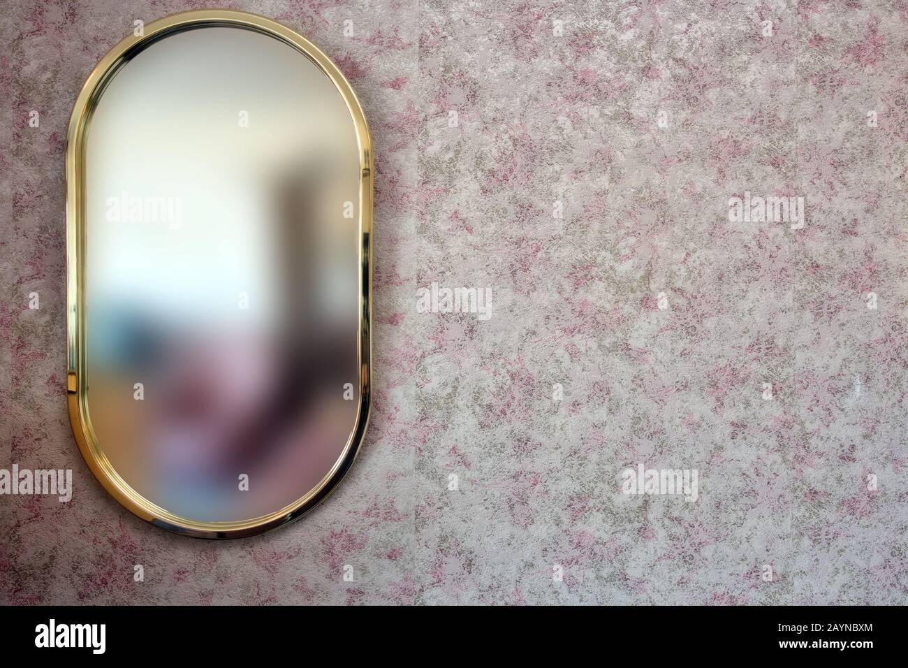 Gold mirror with vintage patterned wallpaper background, space for text Stock Photo