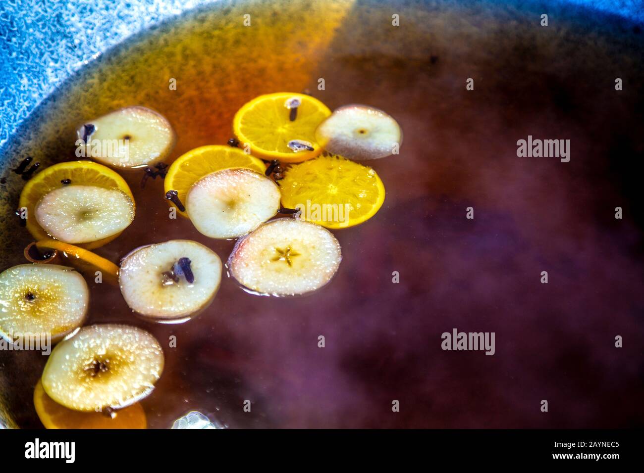Mulled white wine with apple and orange slices and cloves at Szabadsag Square Market, Budapest, Hungary Stock Photo