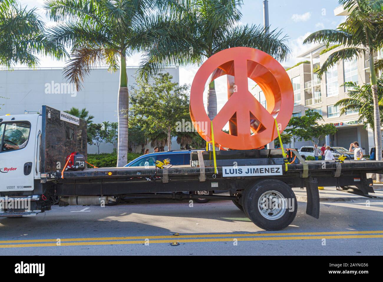Miami Florida,Midtown,Art Basel,Art Miami,artist,self marketing,flatbed truck,peace symbol,sculpture,visitors travel traveling tour tourist tourism la Stock Photo