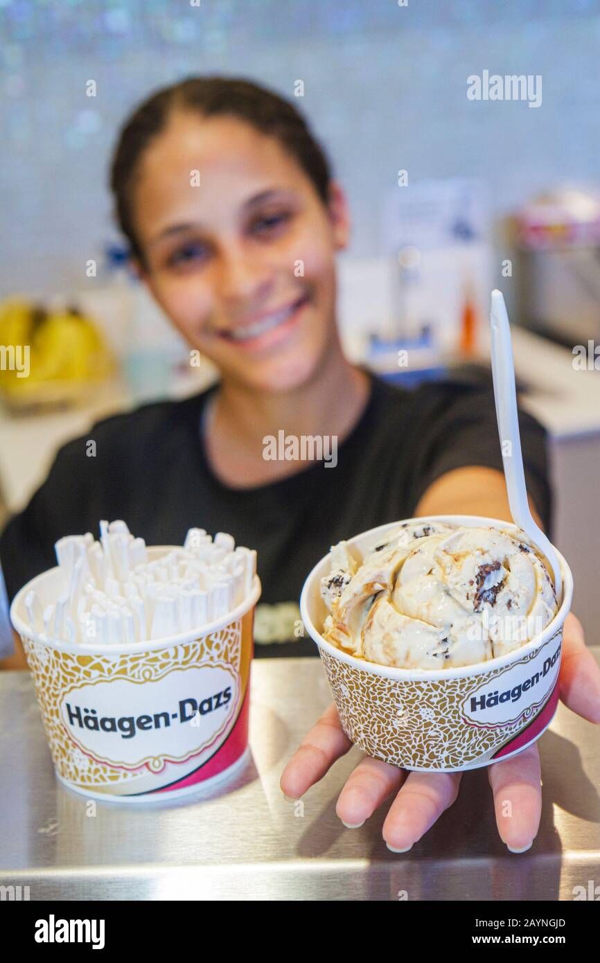 Miami Beach Florida,Haagen Dazs Ice Cream,Hispanic clerk,cup,FL101231053 Stock Photo