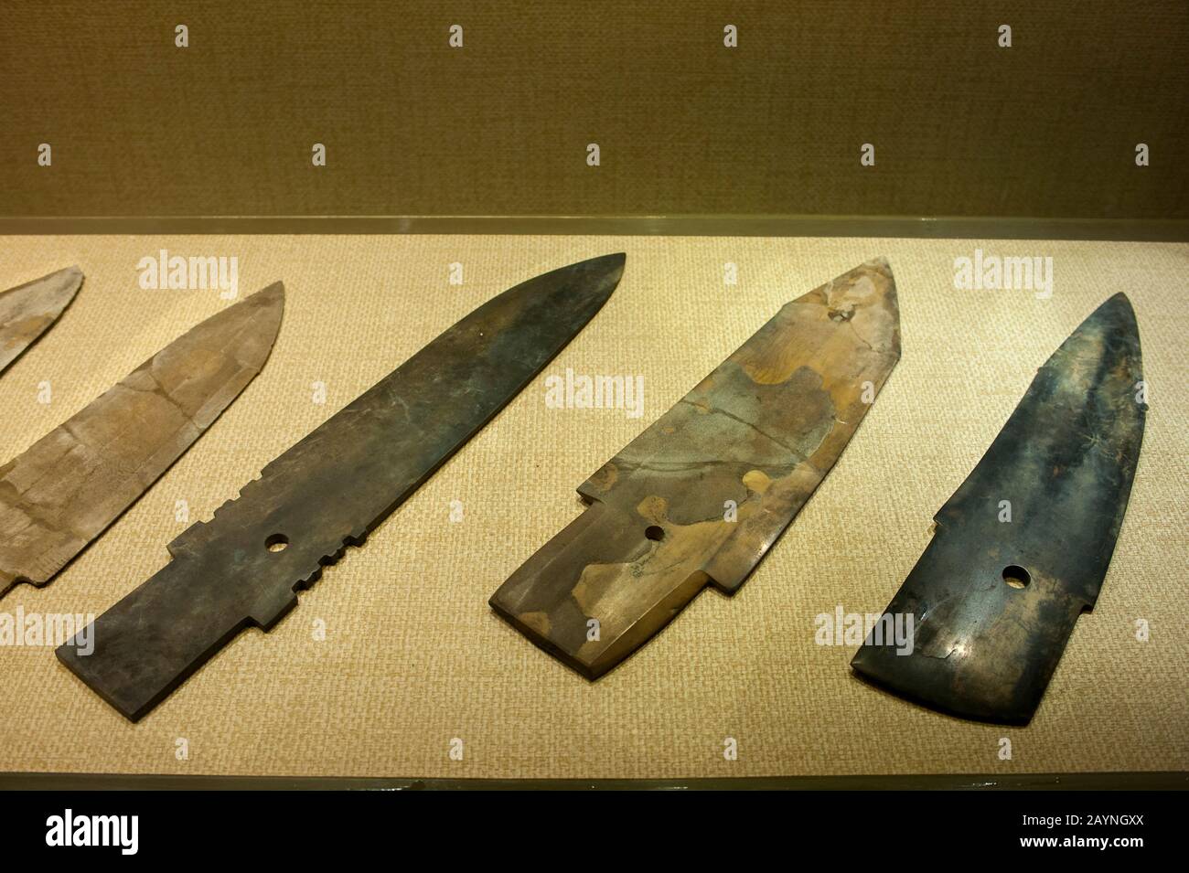 Jade daggers in the exhibit of ancient artifacts at the Sanxingdui Museum in Sanxingdui near Chengdu, Sichuan Province in China. Stock Photo