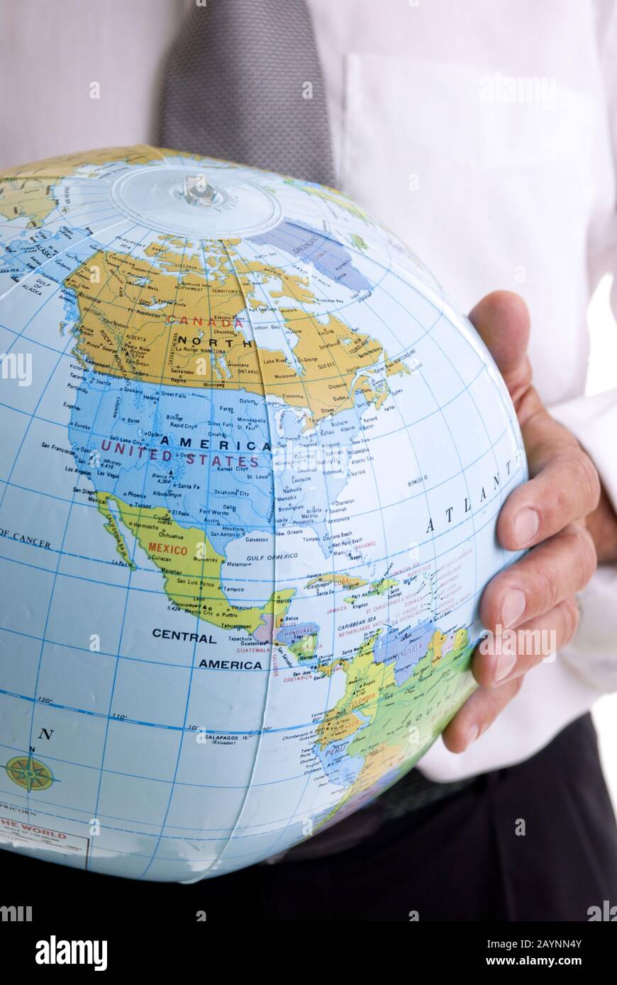 Businessman is holding an Earth in his hands *** Local Caption ...