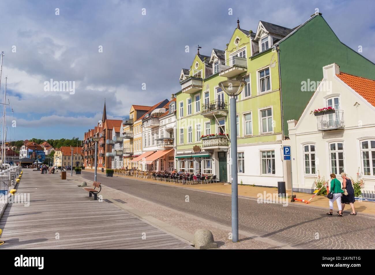 Wooden jetty and colorful houses in the harbor of Sonderborg, Denmark ...
