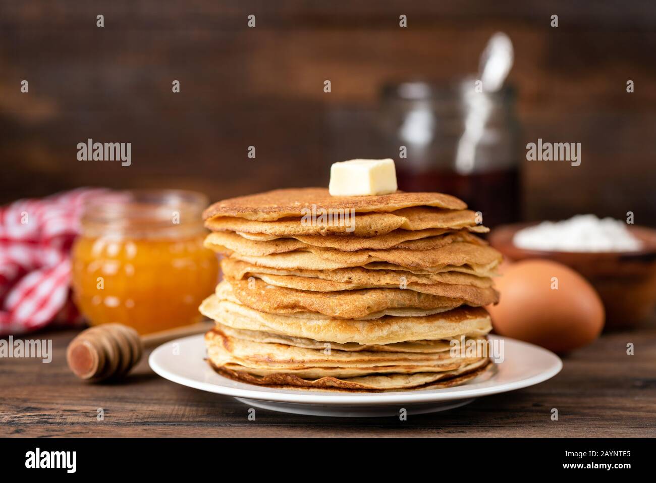 Stack Of Homemade Crepes, Blini, Thin Pancakes With Honey And Butter. Russian Maslenitsa Holiday Concept Stock Photo