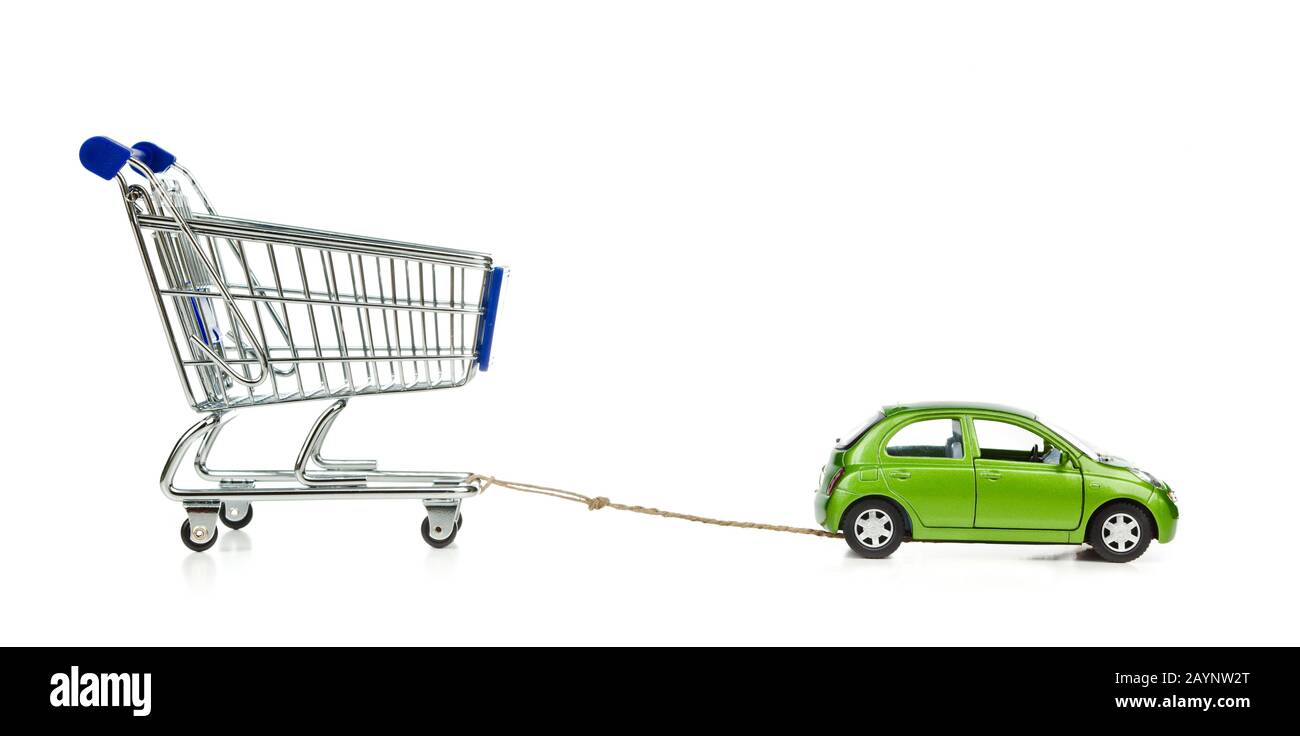 Isolated Shopping Cart with green car on white background. Car sale concept. Stock Photo