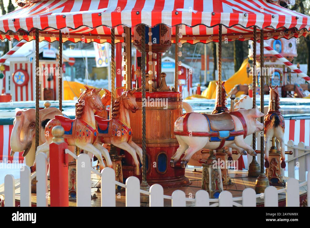 Horses carousel at the amusement entertainment park. Colorful carousel with horses, amusement park element. Children s entertainment, merry-go-round Stock Photo