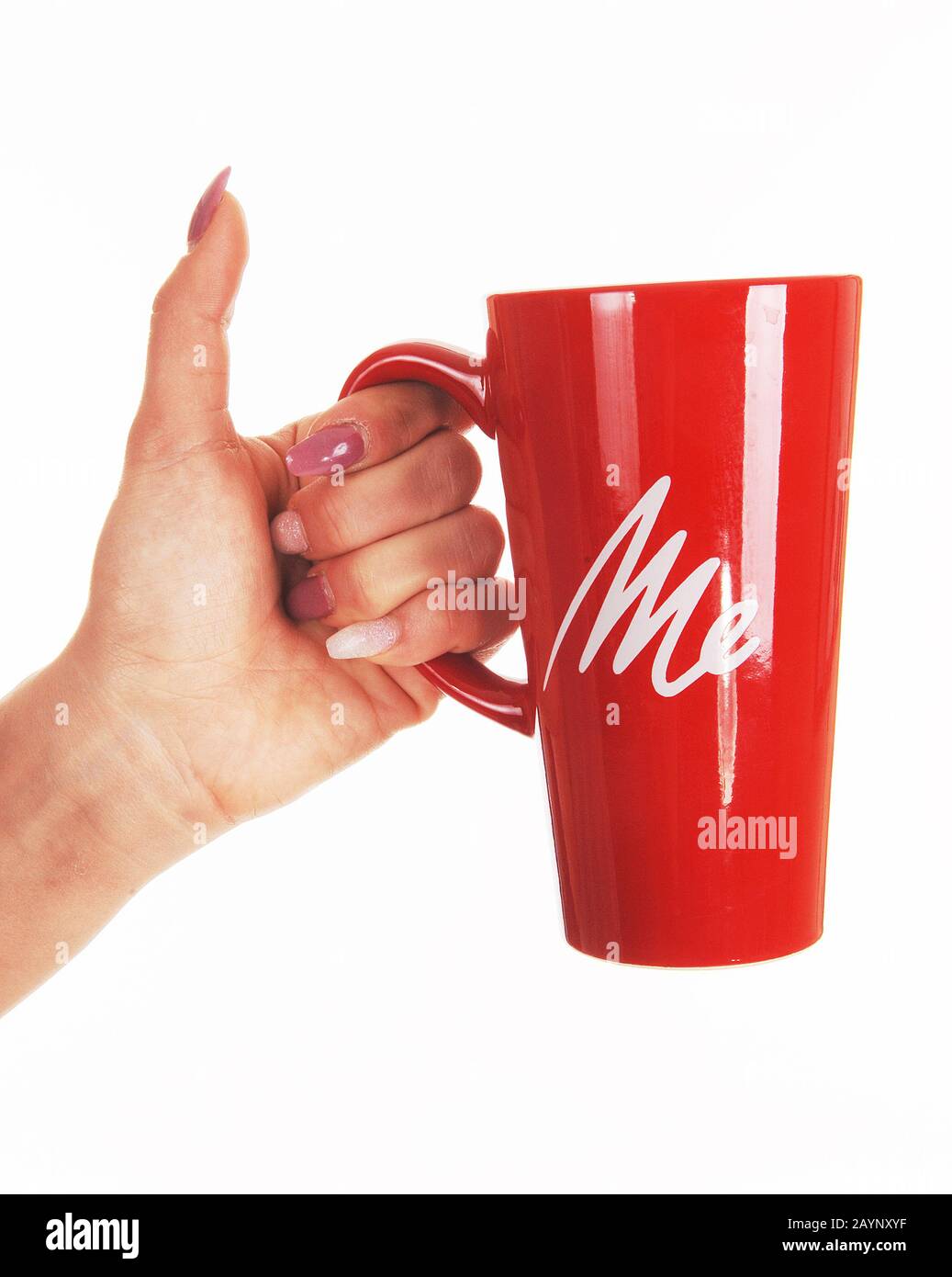 A close up image of the hand of a woman holding a red coffee mug with ME written on, isolated for white background Stock Photo
