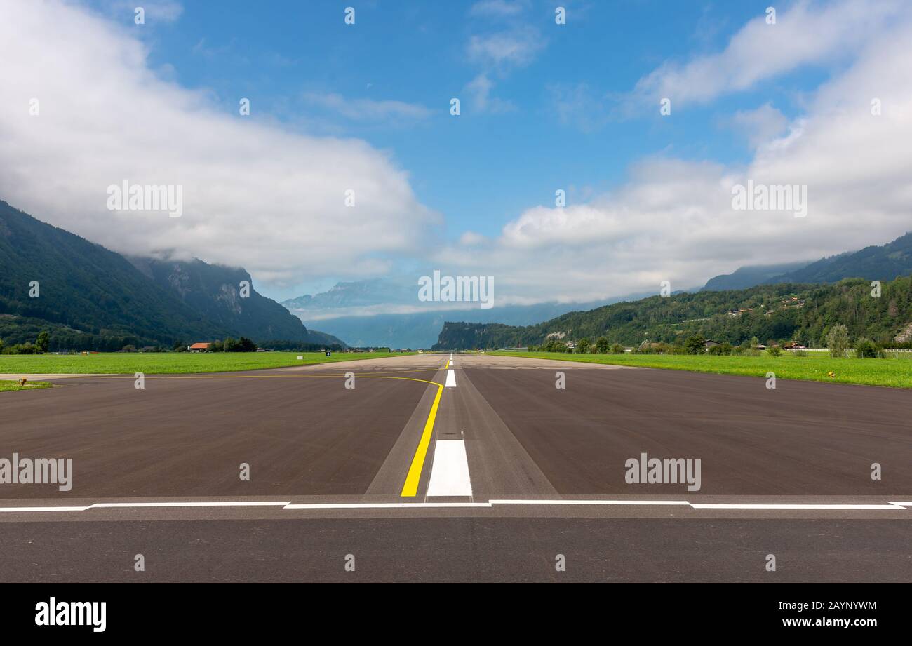 Meiringen Air Base, under the Reichenbachfalle, a scene military base of the Swiss Air Force with a public road crossing the runway. Stock Photo