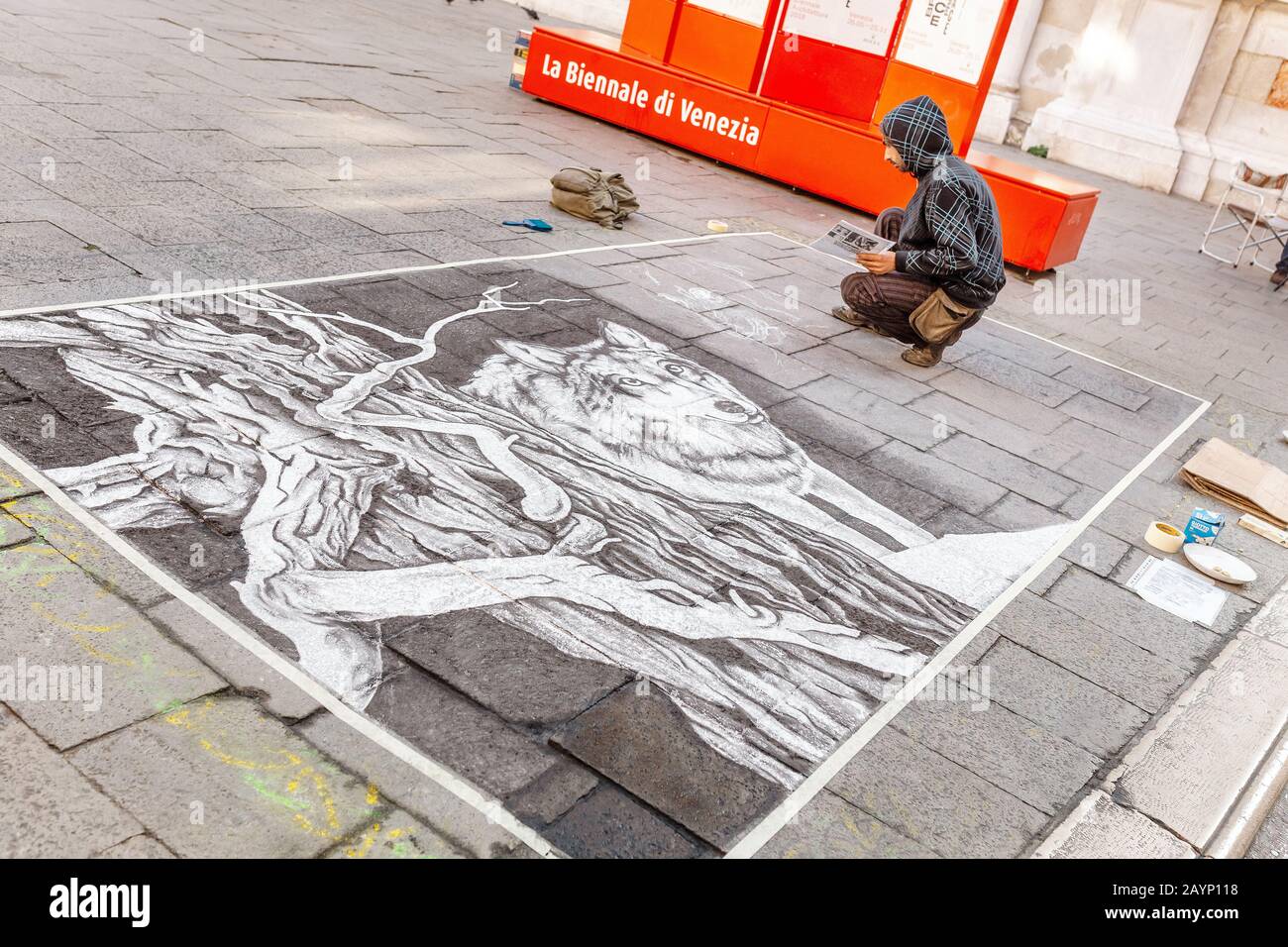23 OCTOBER 2018, VENICE, ITALY: A street artist draws a picture on an asphalt Stock Photo