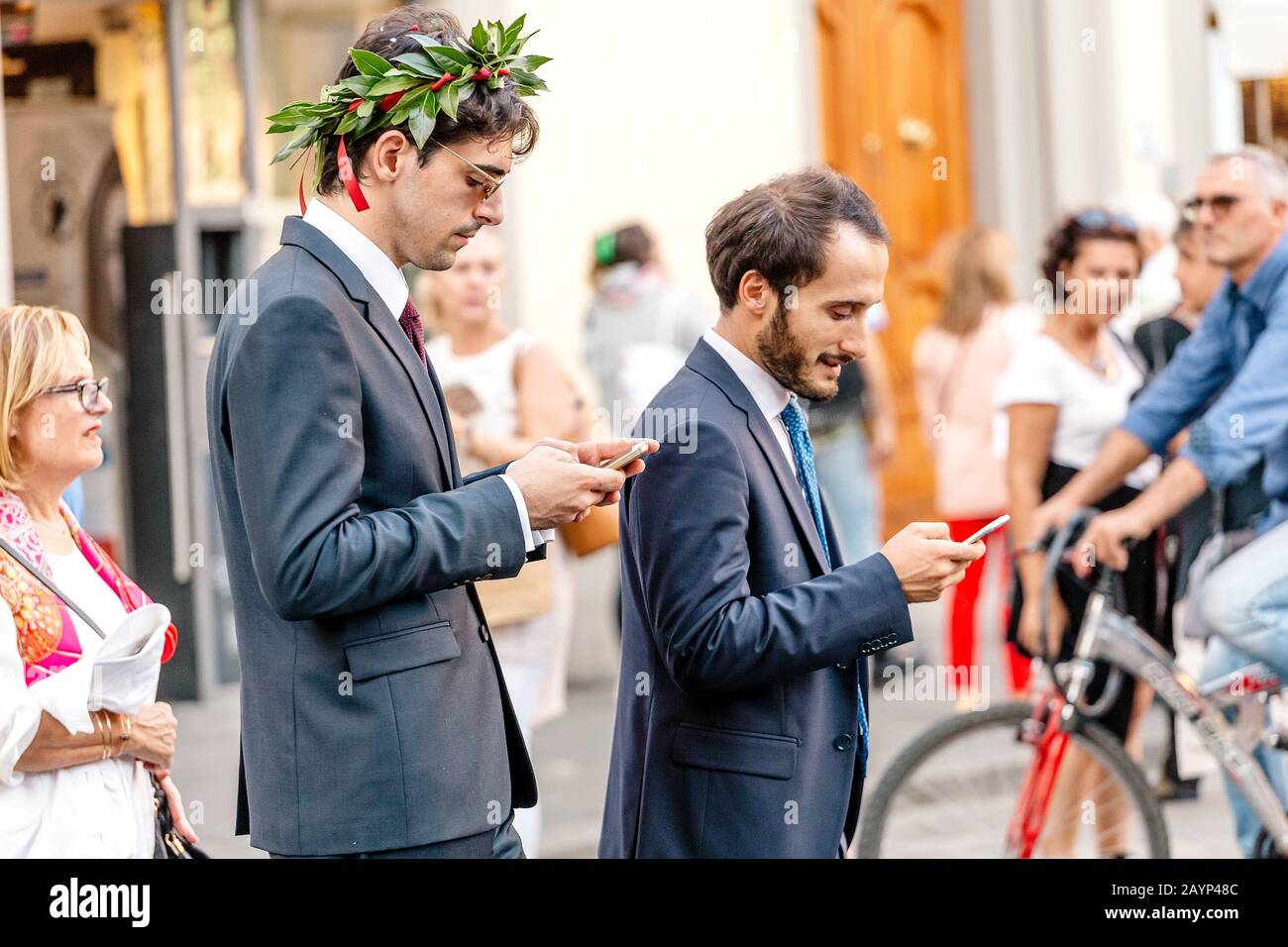 19 OCTOBER 2018, FLORENCE, ITALY: Graduated student with laurel wreath Stock Photo