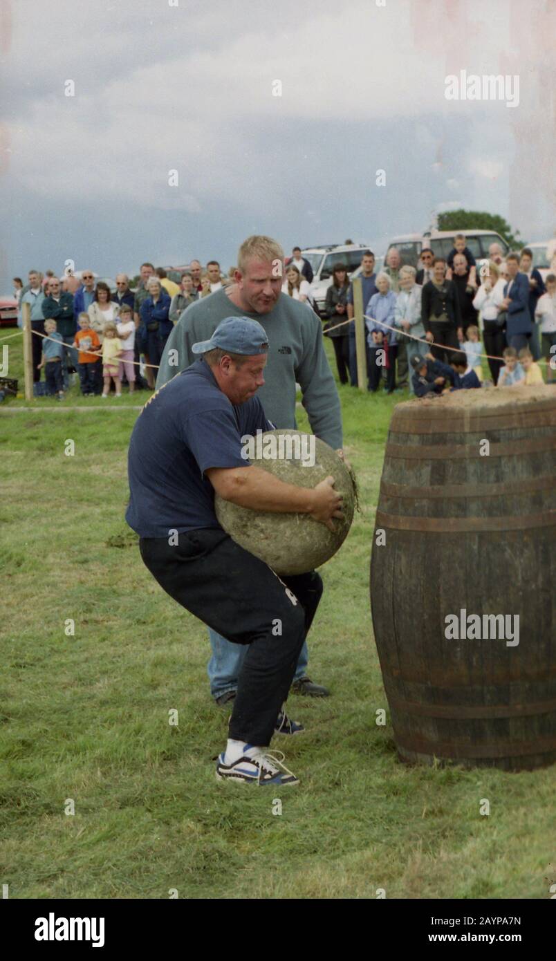 Lifting heavy stone hires stock photography and images Alamy