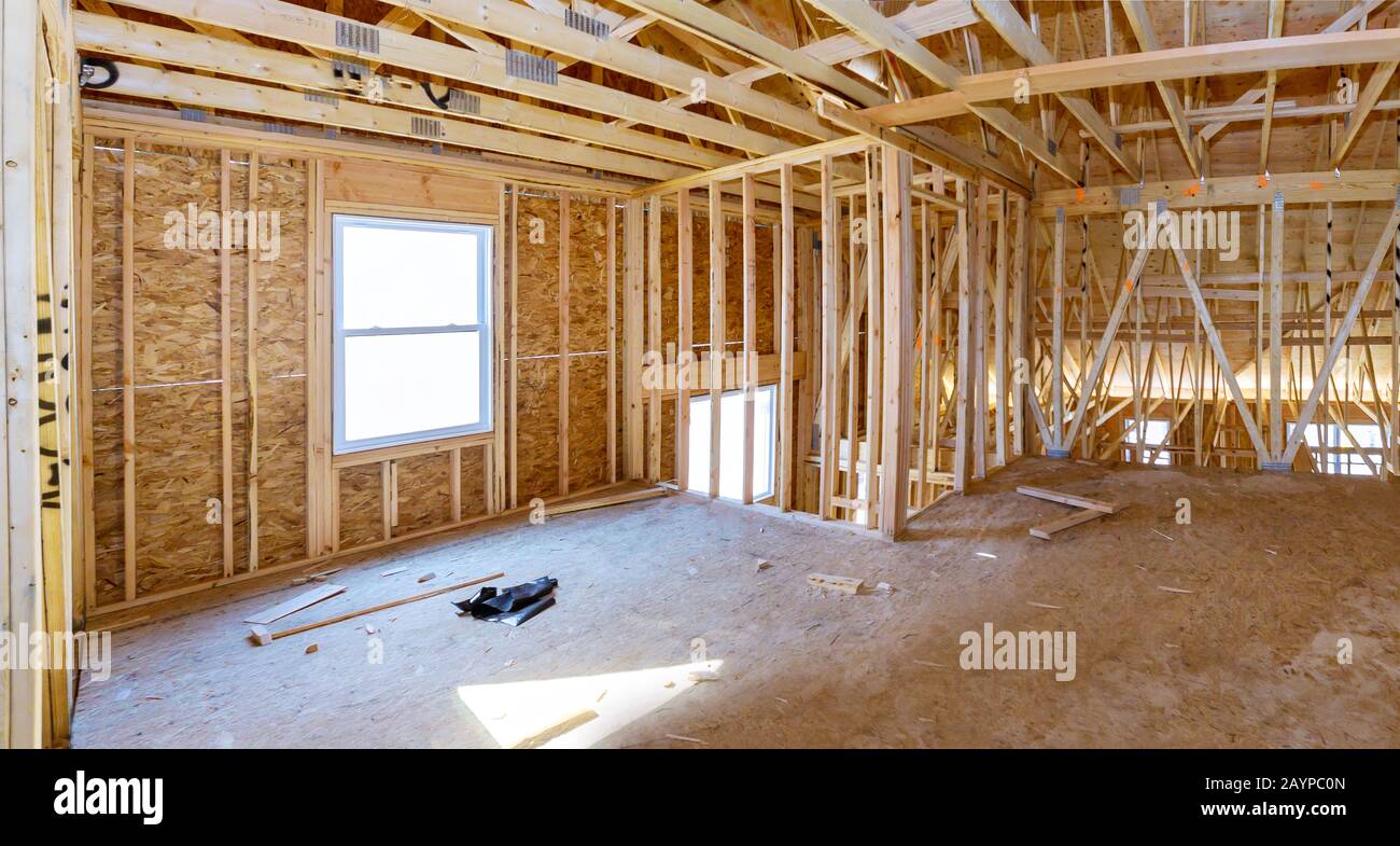Wooden roof framework on stick built home under construction the framing Stock Photo