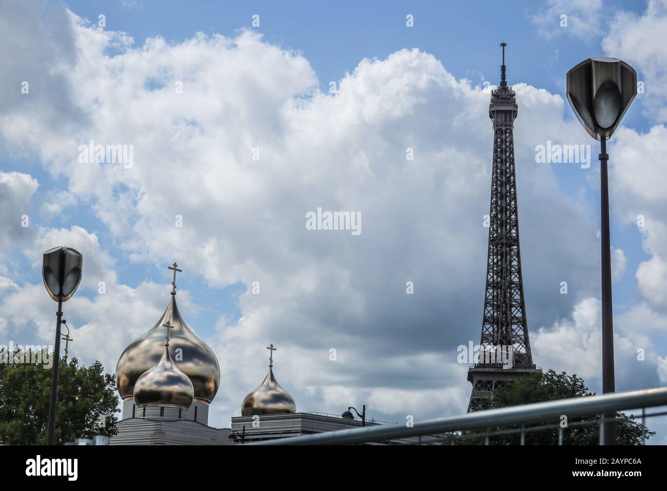 Eiffel Tower, street lamps and the Russian cathedral of the holy trinity in Paris, France, Europe Stock Photo