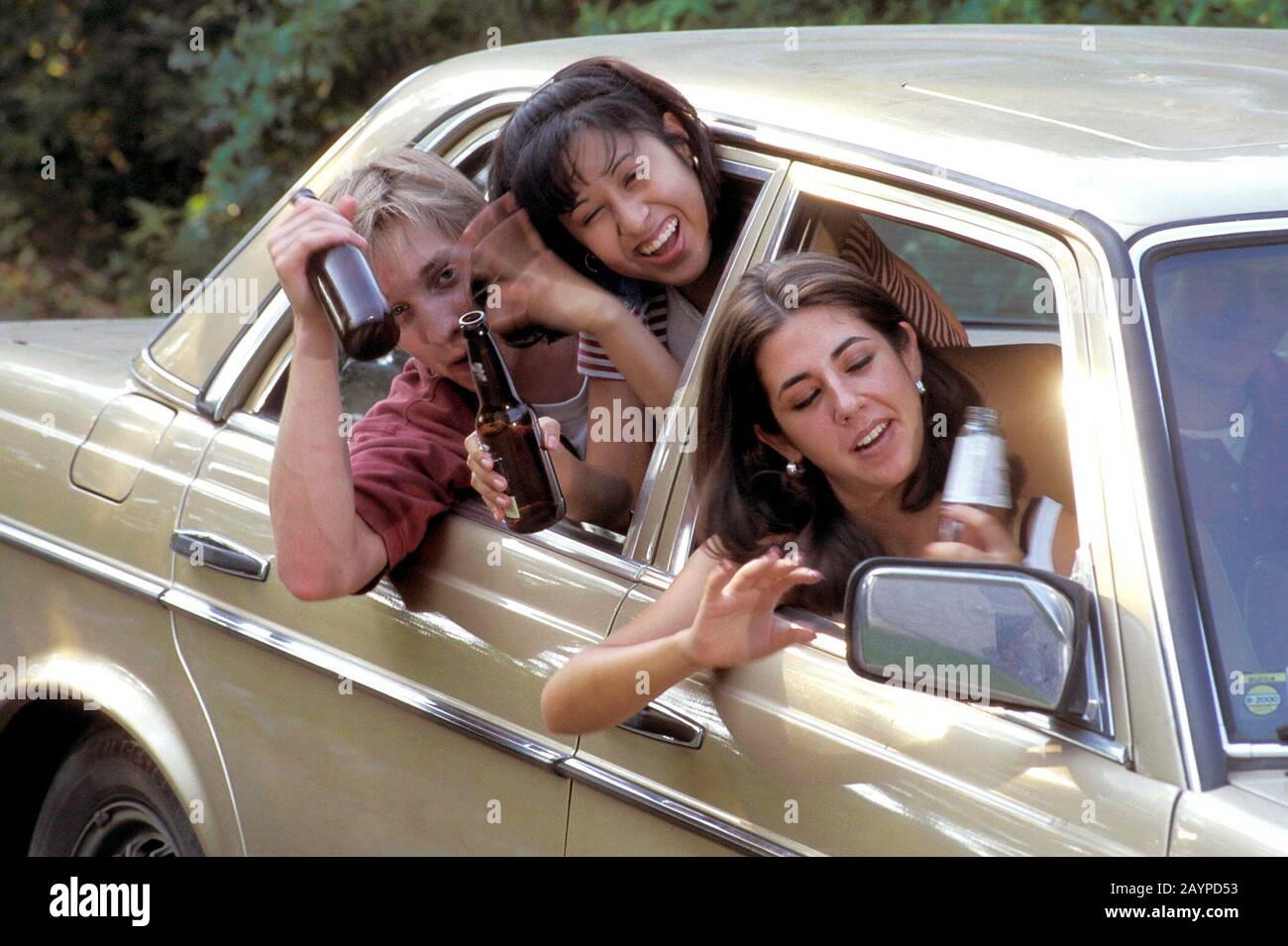 Austin, Texas USA Teens drinking alcohol while on road trip. ©Bob