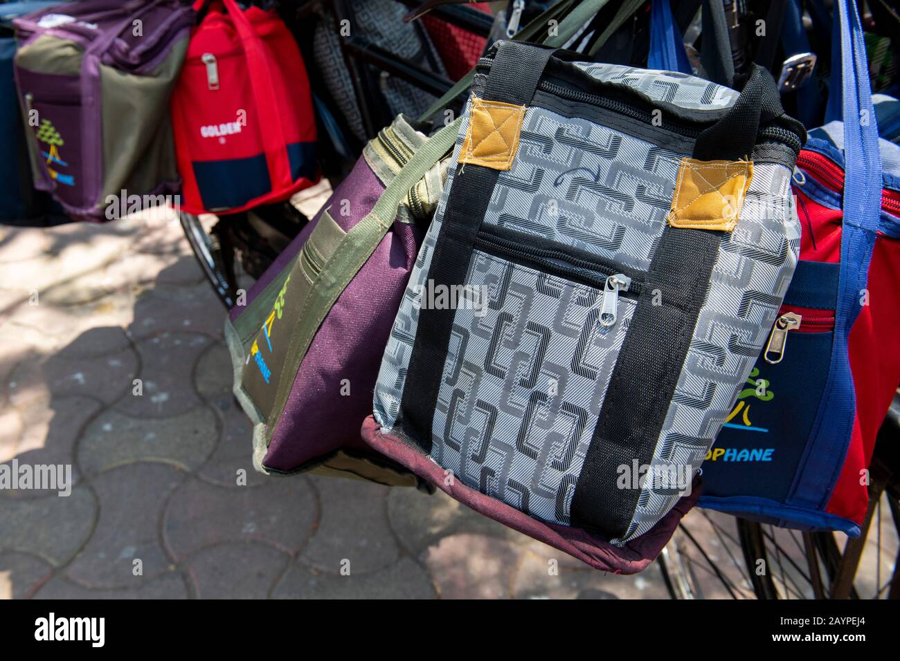 India, Mumbai aka Bombay. Dabbawalas (aka dabbawallas or dabbawallahs, tiffin wallahs) deliver lunches all over the city every day. Detail of bags. Stock Photo