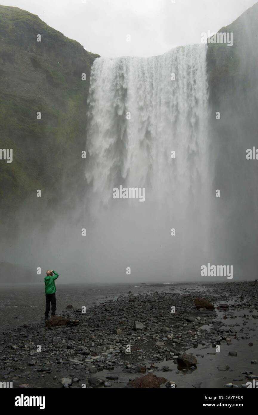60 Feet In Meters Tourist at the Skogafoss, which is one of the biggest waterfalls in  southern Iceland with a width of 15 meters (49 feet) and a drop of 60 m  (200 ft Stock Photo - Alamy