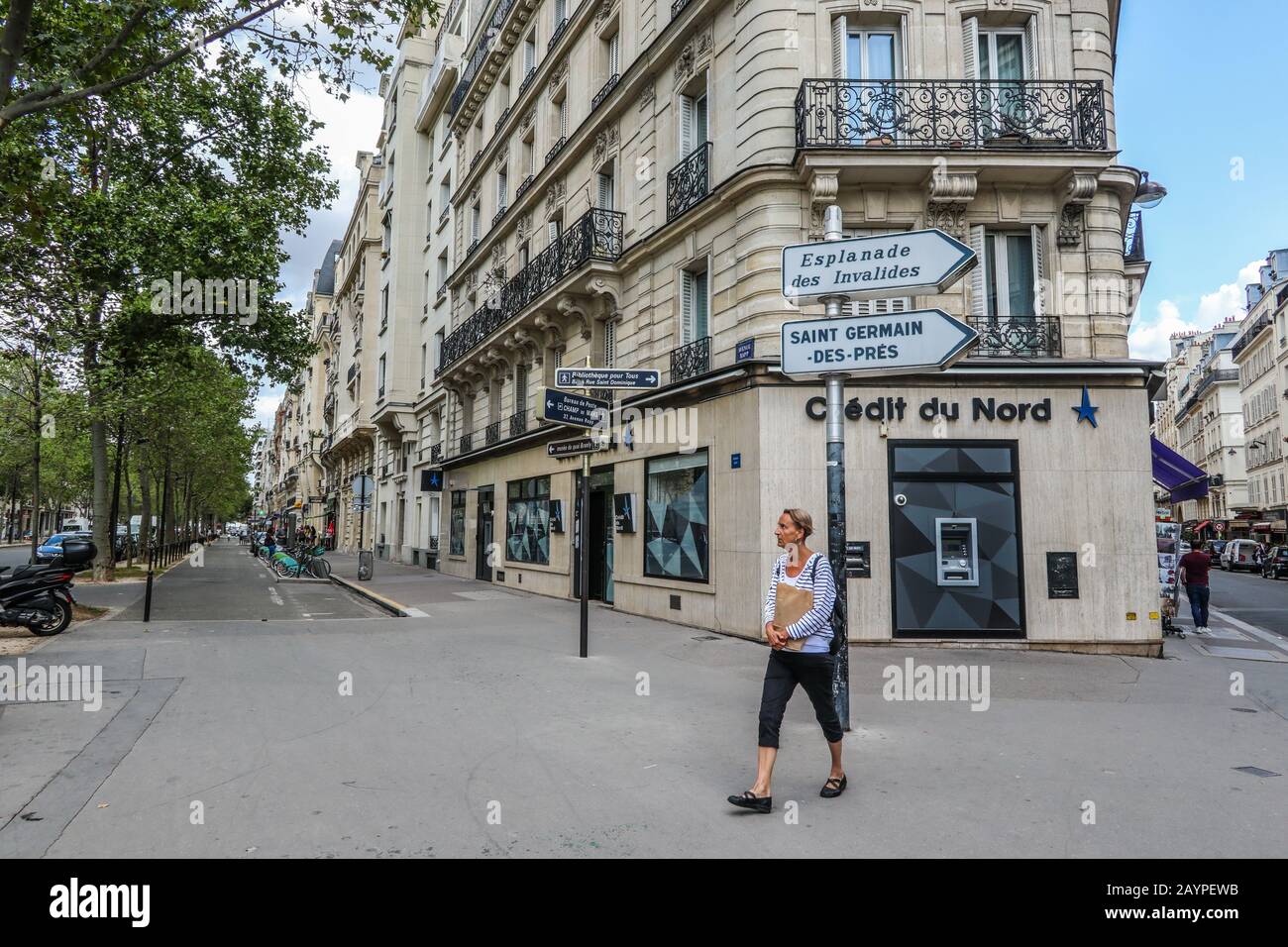 Credit du Nord and woman walking by in Paris, France, Europe Stock Photo