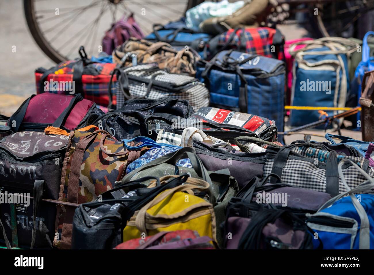 India, Mumbai aka Bombay. Dabbawalas (aka dabbawallas or dabbawallahs, tiffin wallahs) deliver lunches all over the city every day. Detail of bags. Stock Photo