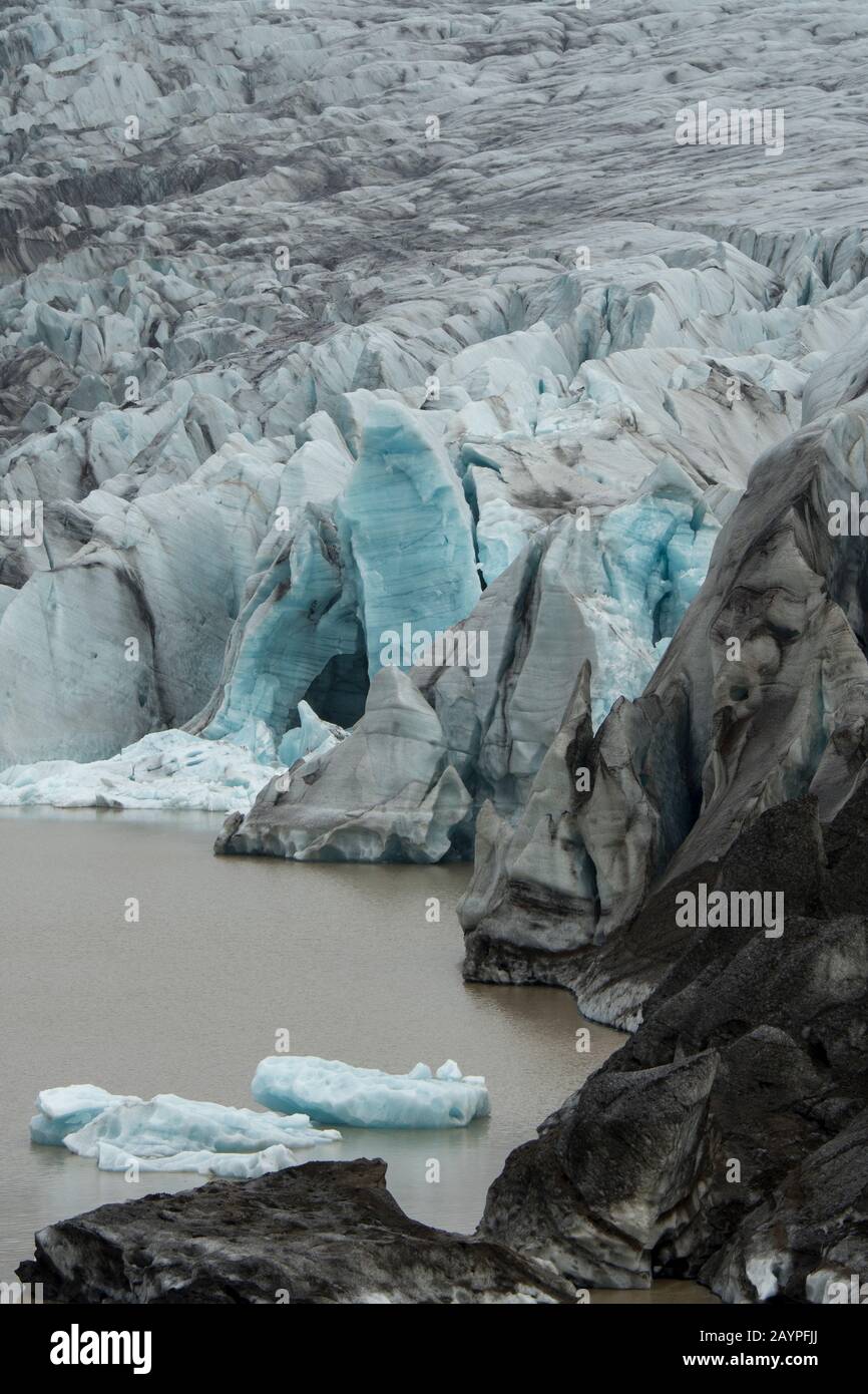 View of the Svinafell Glacier with the glacial lagoon, part of Vatnajökull National Park, in eastern Iceland. Stock Photo