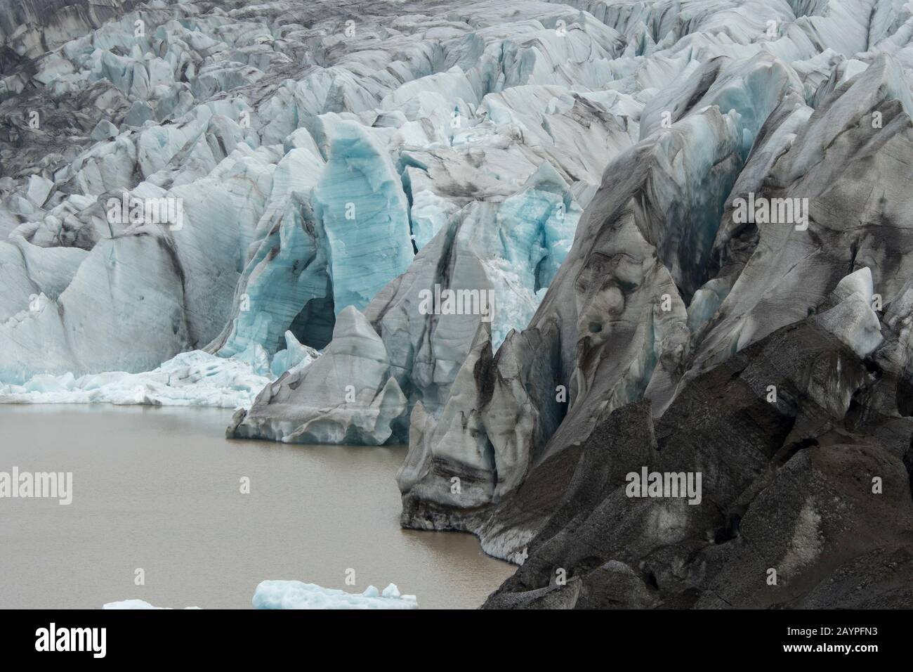 View of the Svinafell Glacier with the glacial lagoon, part of Vatnajökull National Park, in eastern Iceland. Stock Photo