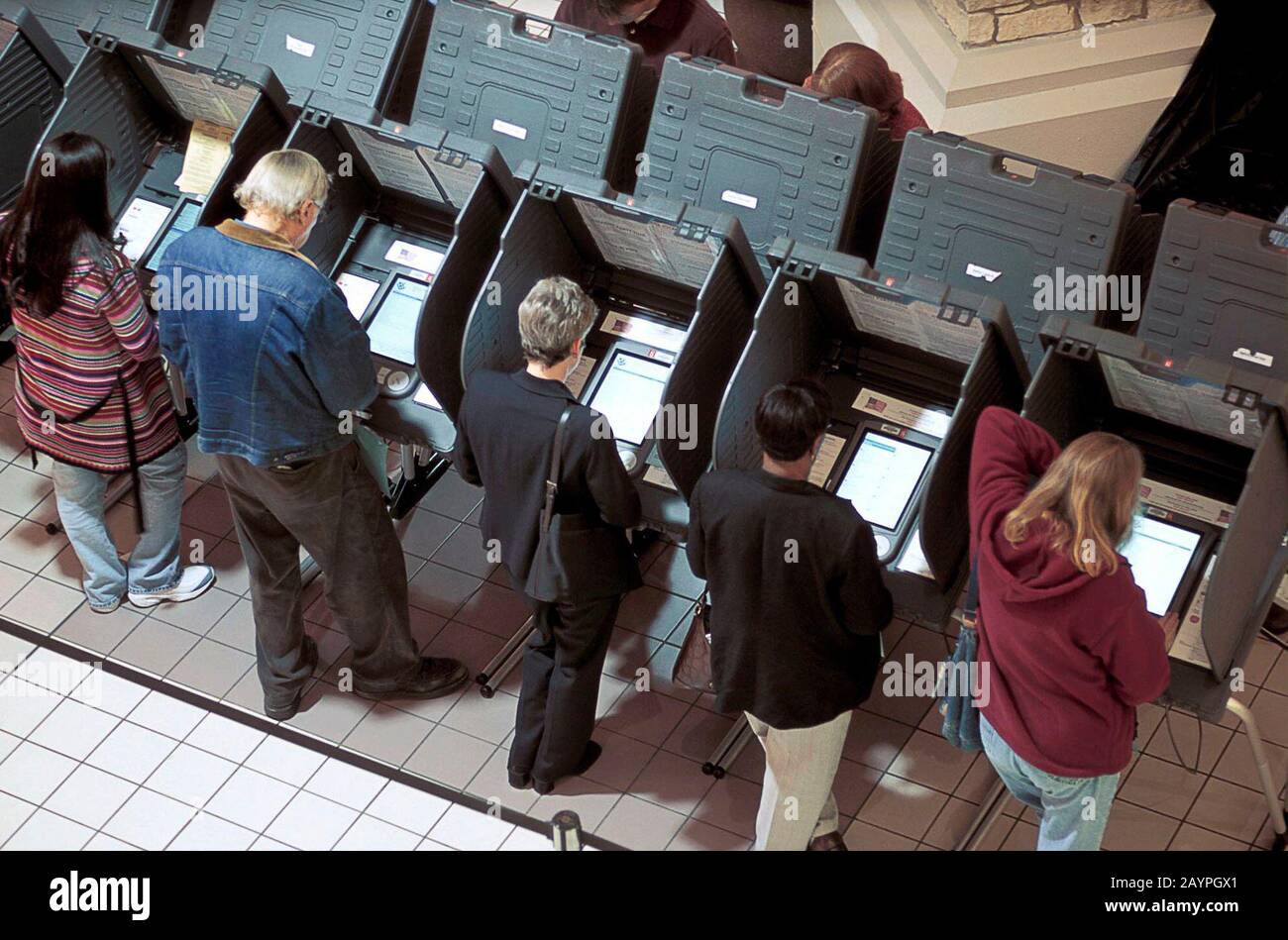 Austin, Texas: Overhead view of voters using electronic voting machines at polling place in shopping mall. November 2002  ©Bob Daemmrich Stock Photo