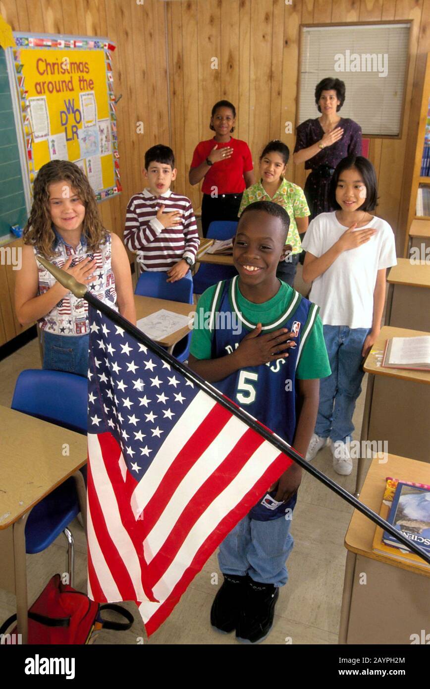 Austin, TX:  Fourth grade students recite Pledge of Allegiance in class. ©Bob Daemmrich Stock Photo