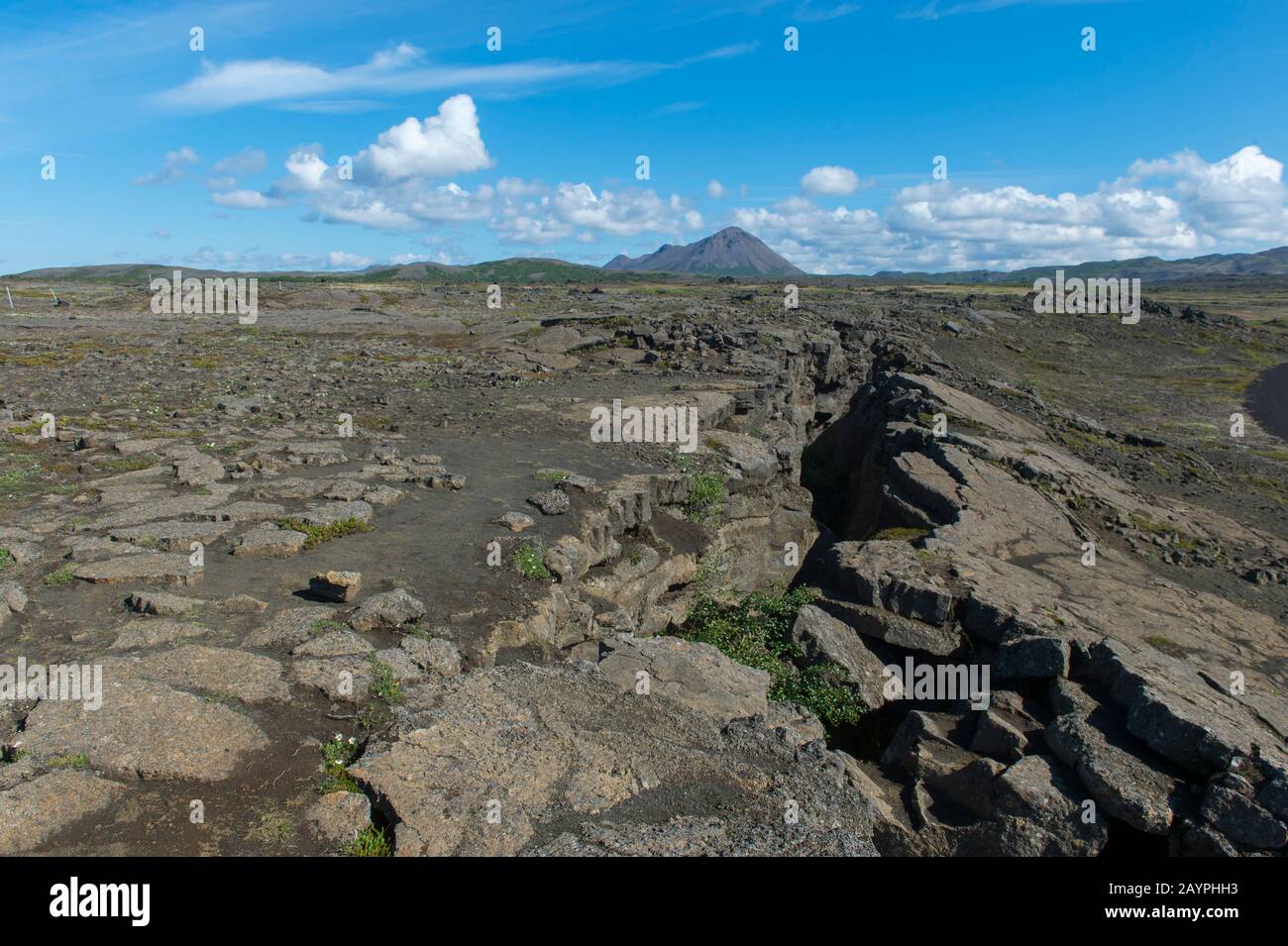 View of the top of Grjotagja, a small lava cave near Lake Myvatn with a thermal spring inside in Northeast Iceland. Stock Photo