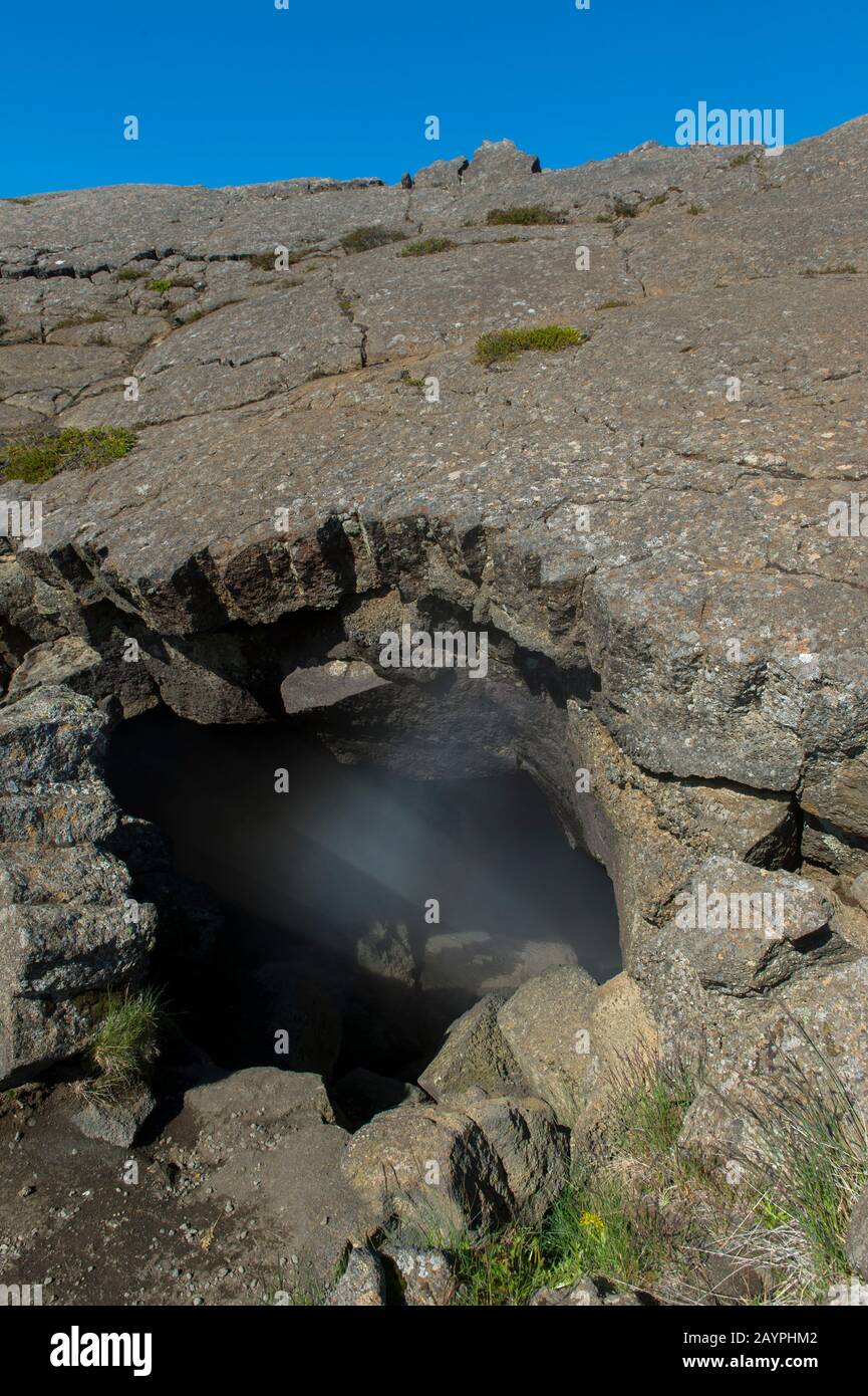 Steam rising from Grjotagja, a small lava cave near Lake Myvatn with a  thermal spring inside in Northeast Iceland Stock Photo - Alamy